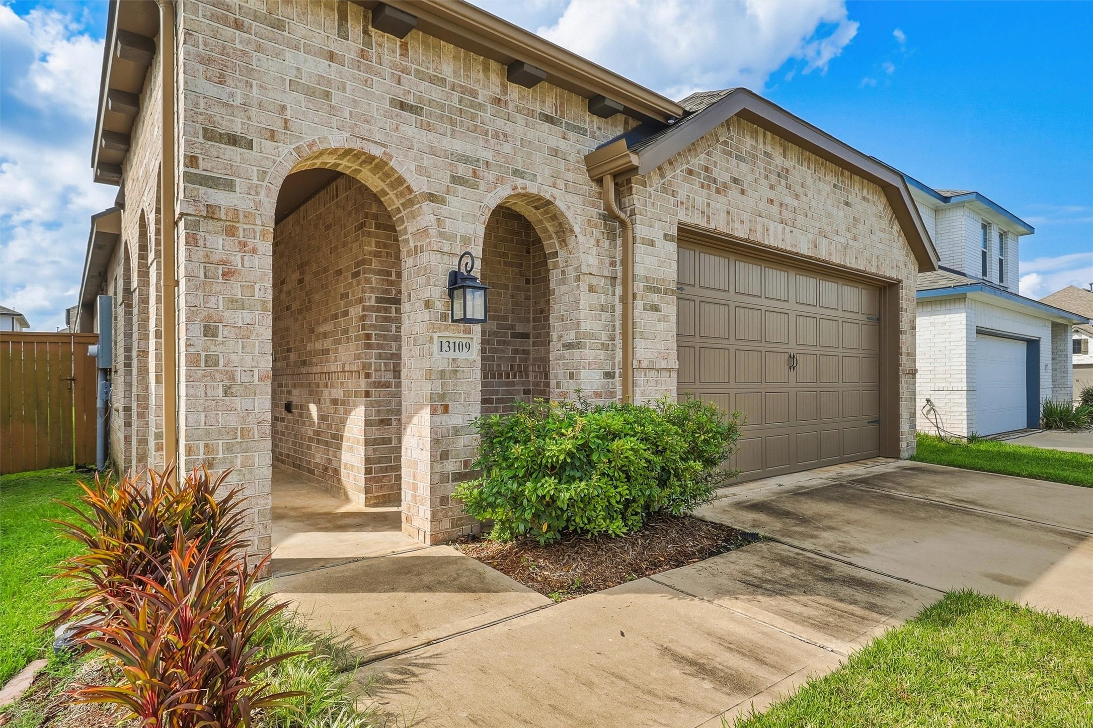 Welcome home to 13109 Blue Flora! This beautiful all-brick Highland Home is a charming gem in one of the coveted GATED sections of LAGO MAR!