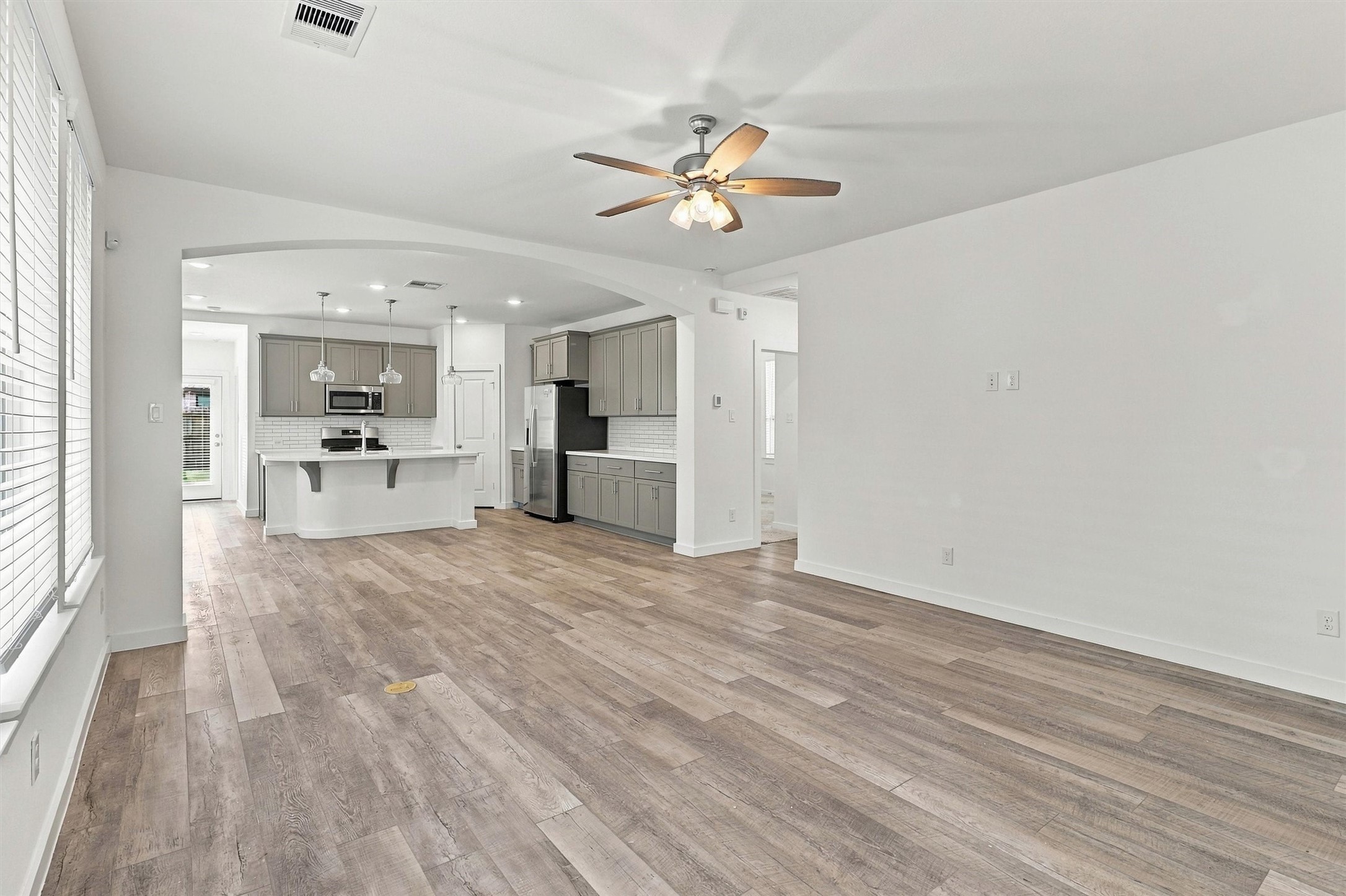 Walk into the home to see lots of natural light, large windows, beautiful LVP flooring, and a gorgeous open floor plan perfect for entertaining!