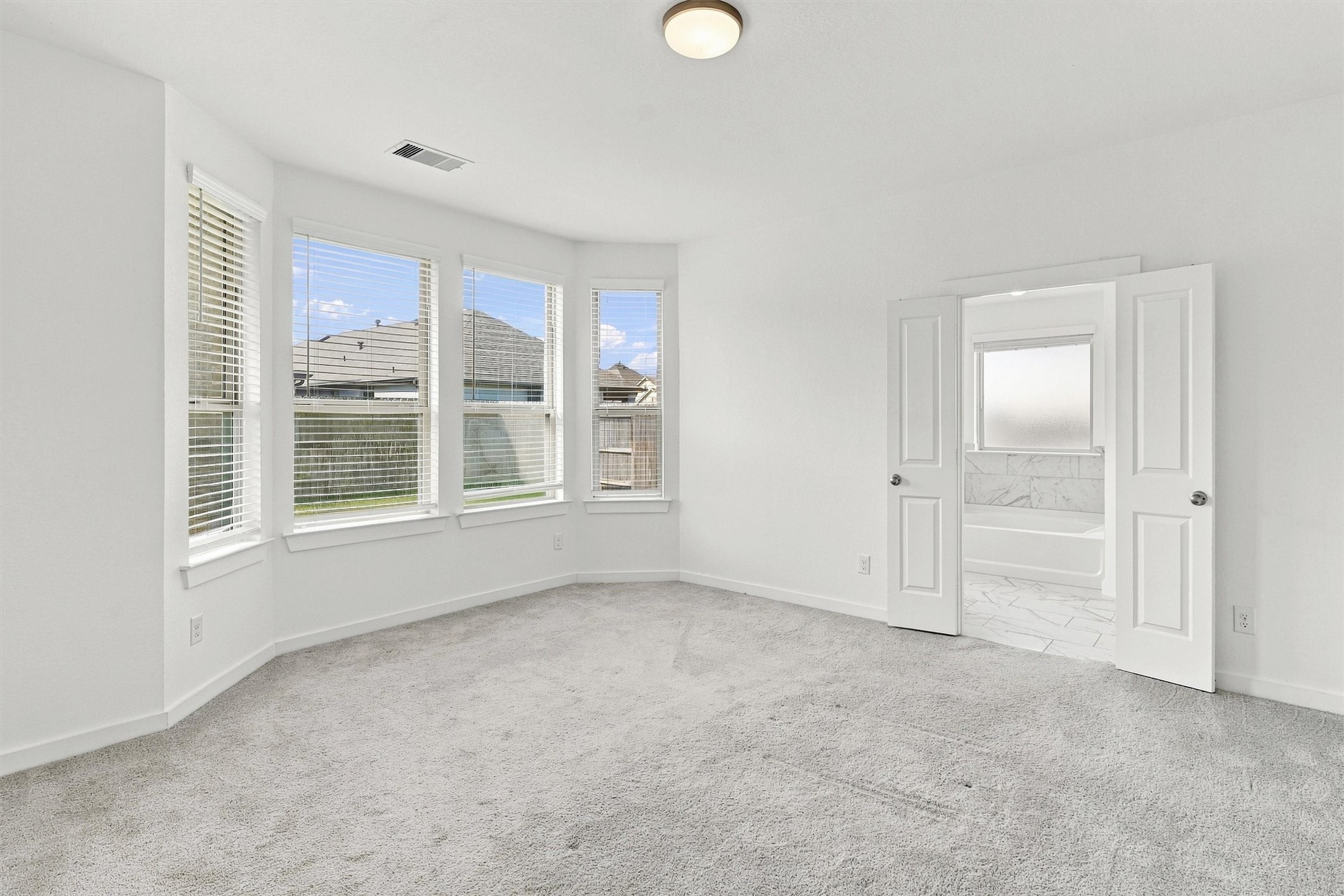 Primary also has it's own ensuite bath and walk-in closet!