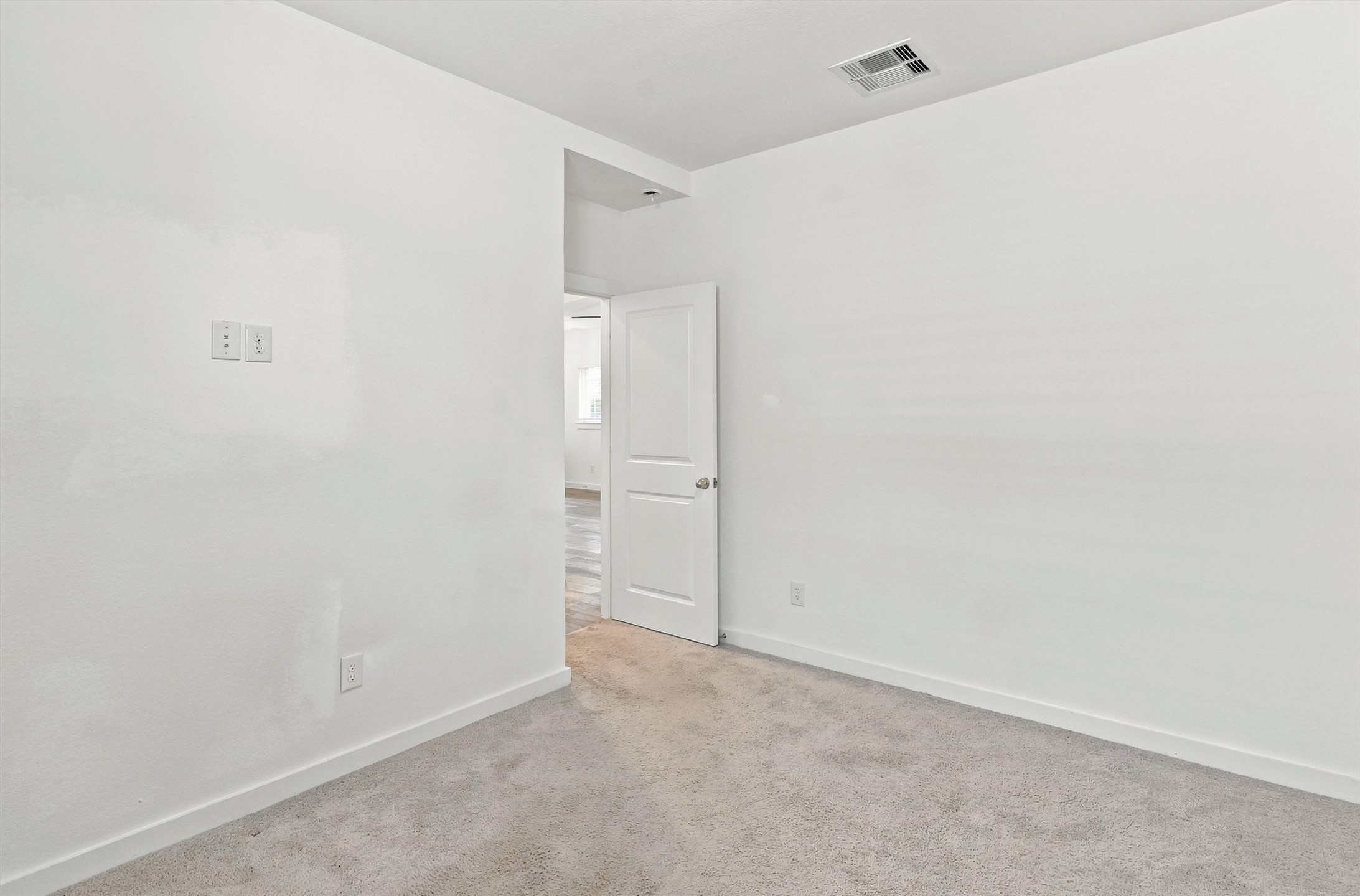 Third bedroom, features carpet and large closet.