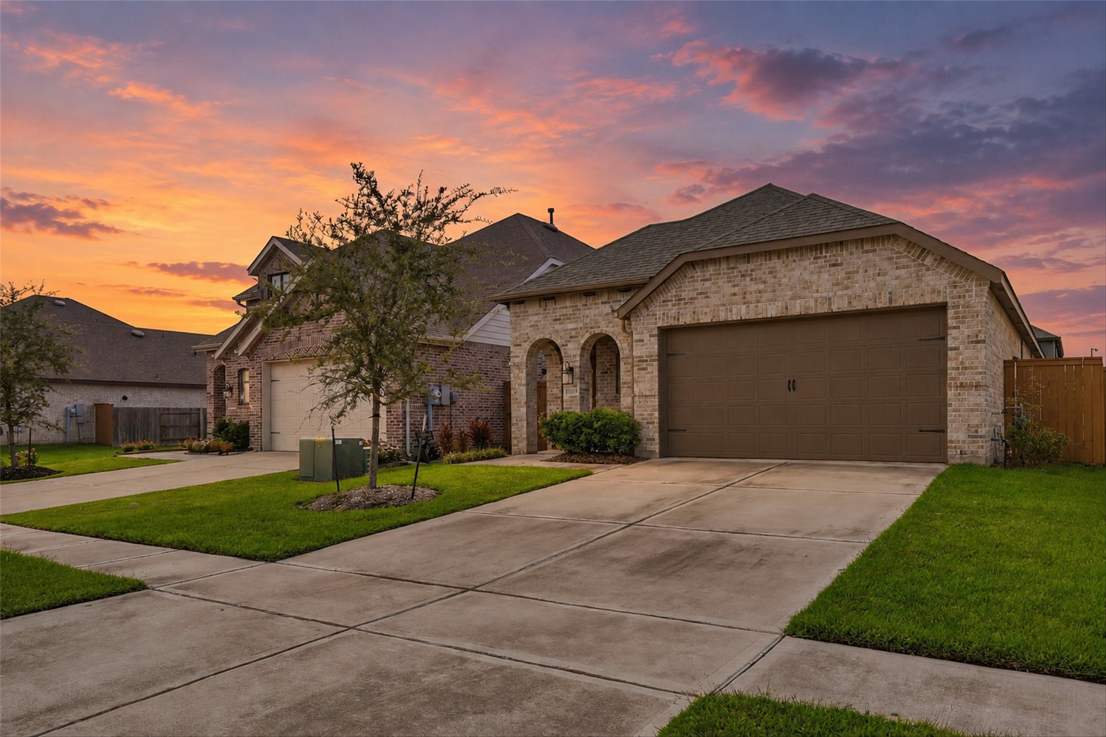This home is beautifully done on the outside, with an all-brick exterior and archways framing the entry, it has so much charm!