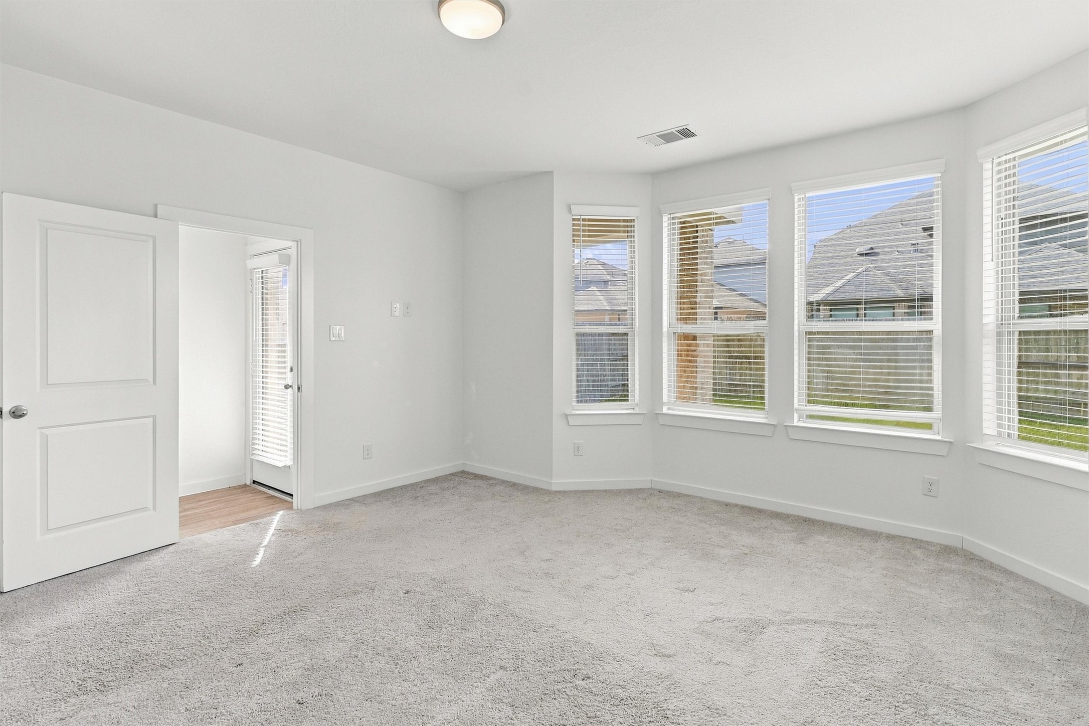 Primary Suite features Bay Windows looking out onto the backyard!