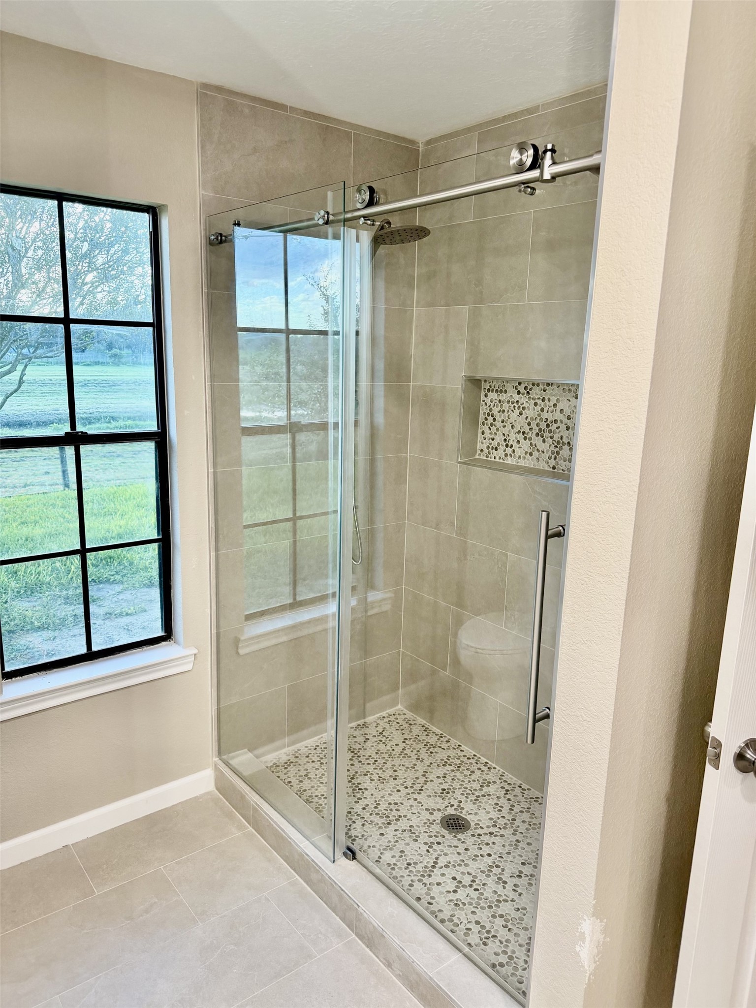 There's a large walk-in shower in the primary bath as well as a large walk-in closet.