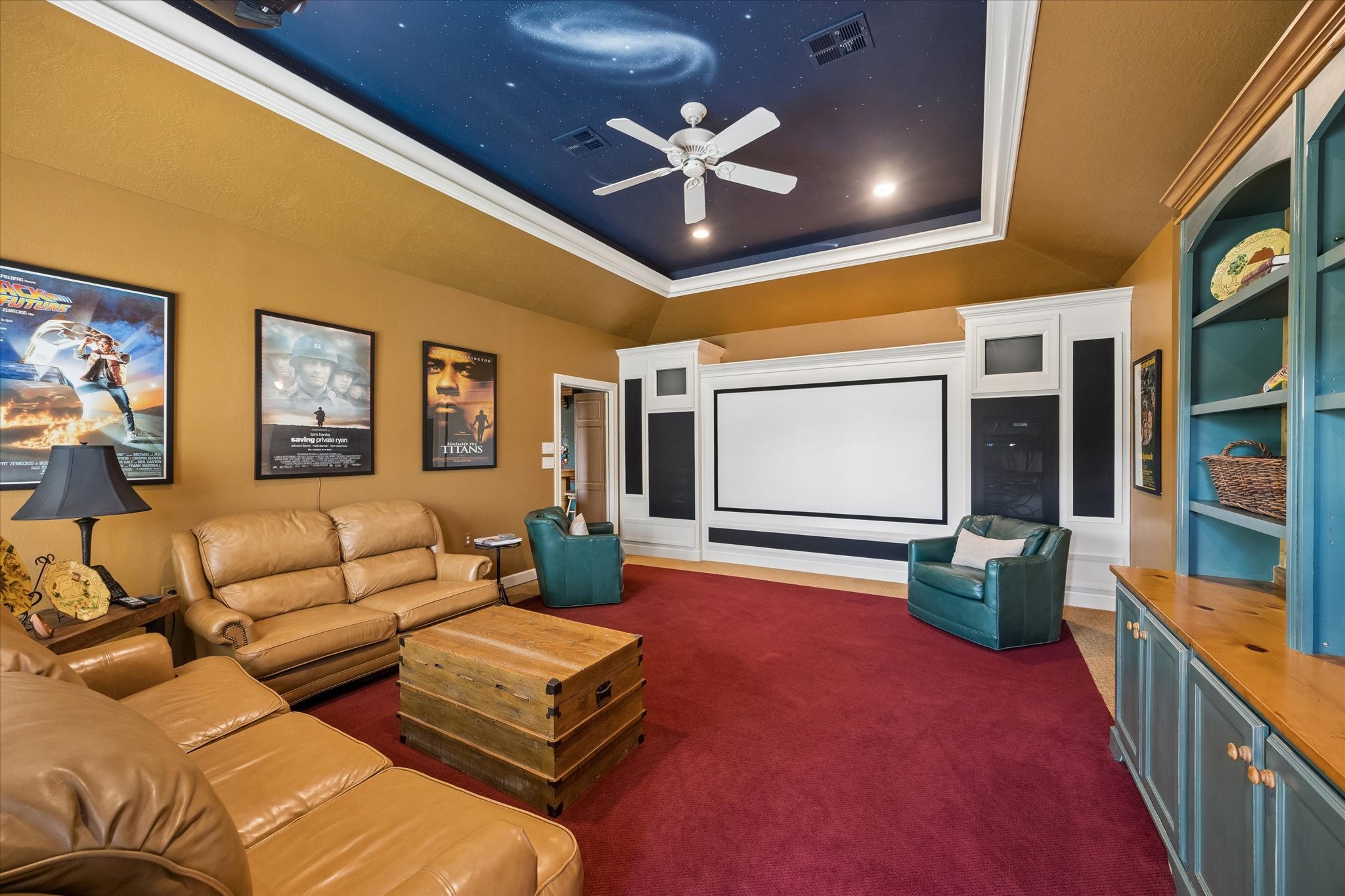 Settle into your favorite seat, dim the lights, and let the show begin. With a dramatic starry ceiling, projection screen, and custom built-ins, this room turns an ordinary movie night into something special.