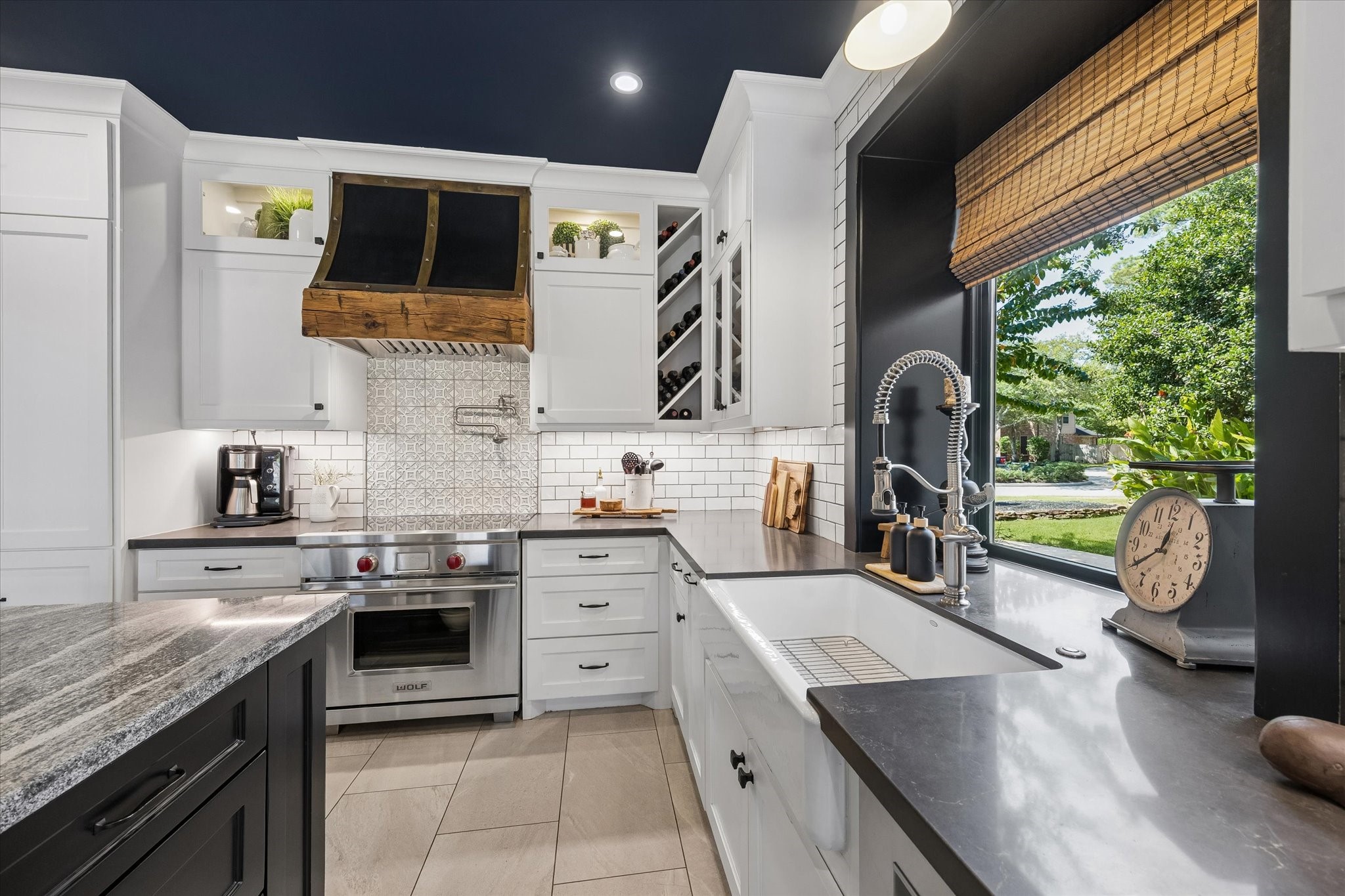 A little sunshine makes even the everyday tasks more enjoyable! Natural light brightens the kitchen workspace, while the conveniently positioned sink and surrounding cabinetry make meal preparation and cleanup feel effortless.