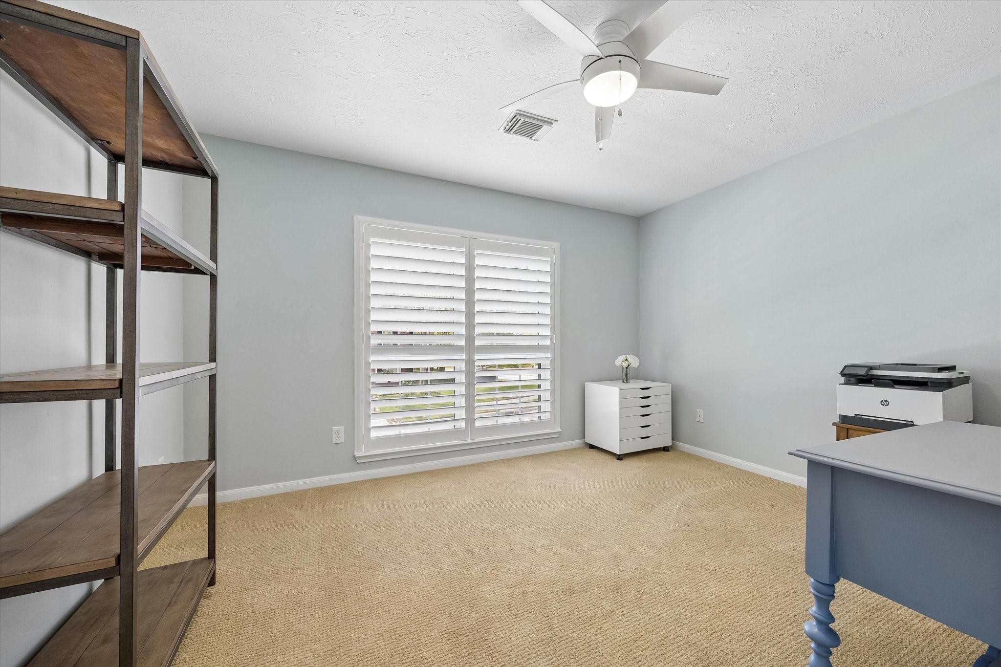 Everyone deserves a space of their own! This inviting secondary bedroom offers flexibility for family members or overnight guests, with room to create a comfortable retreat that reflects their personal style.
