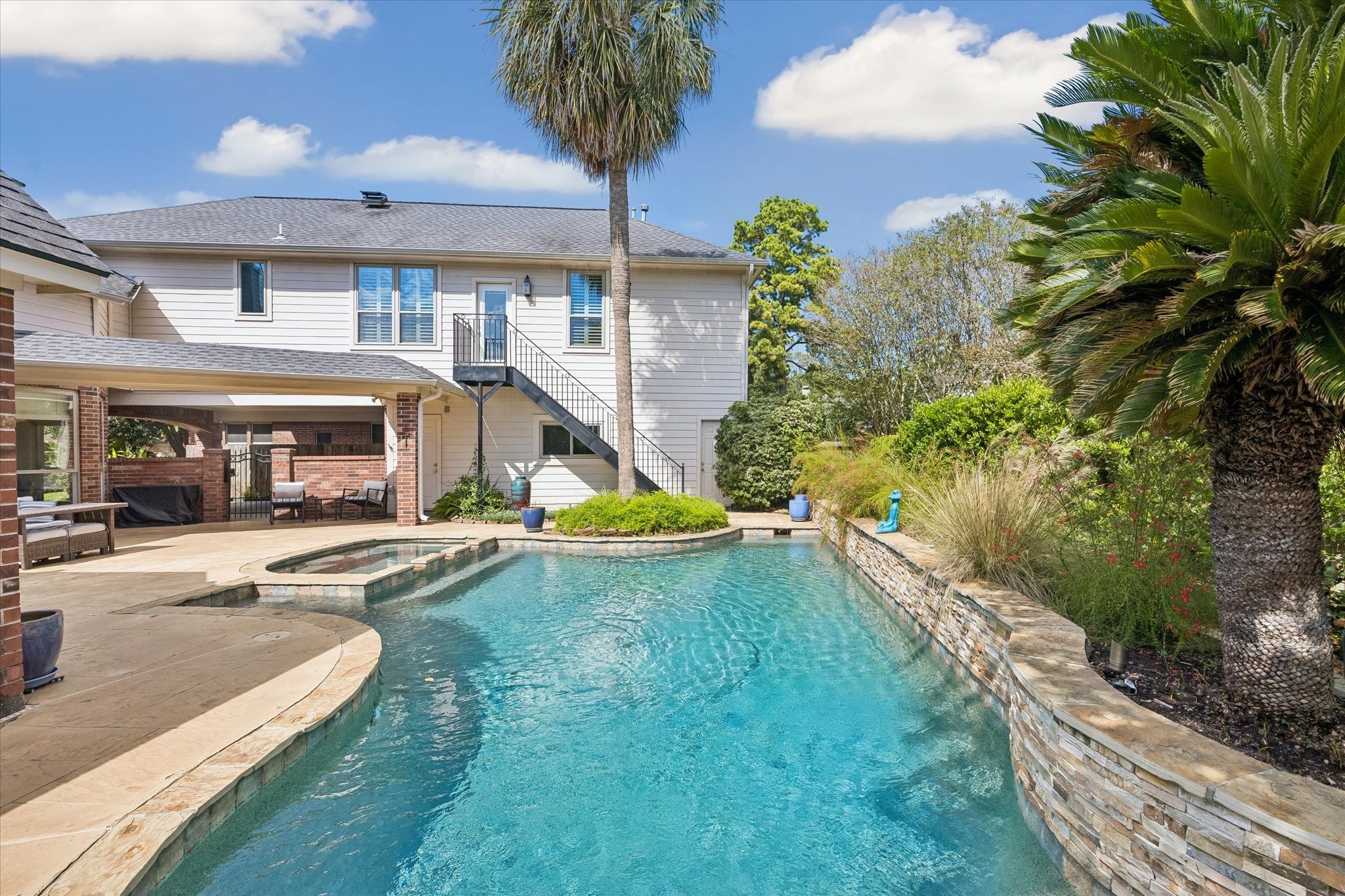 Imagine stepping outside on a beautiful afternoon and having all of this waiting for you. A sparkling pool, inviting spa, expansive patio, and outdoor living areas create a setting you'll want to enjoy every chance you get.