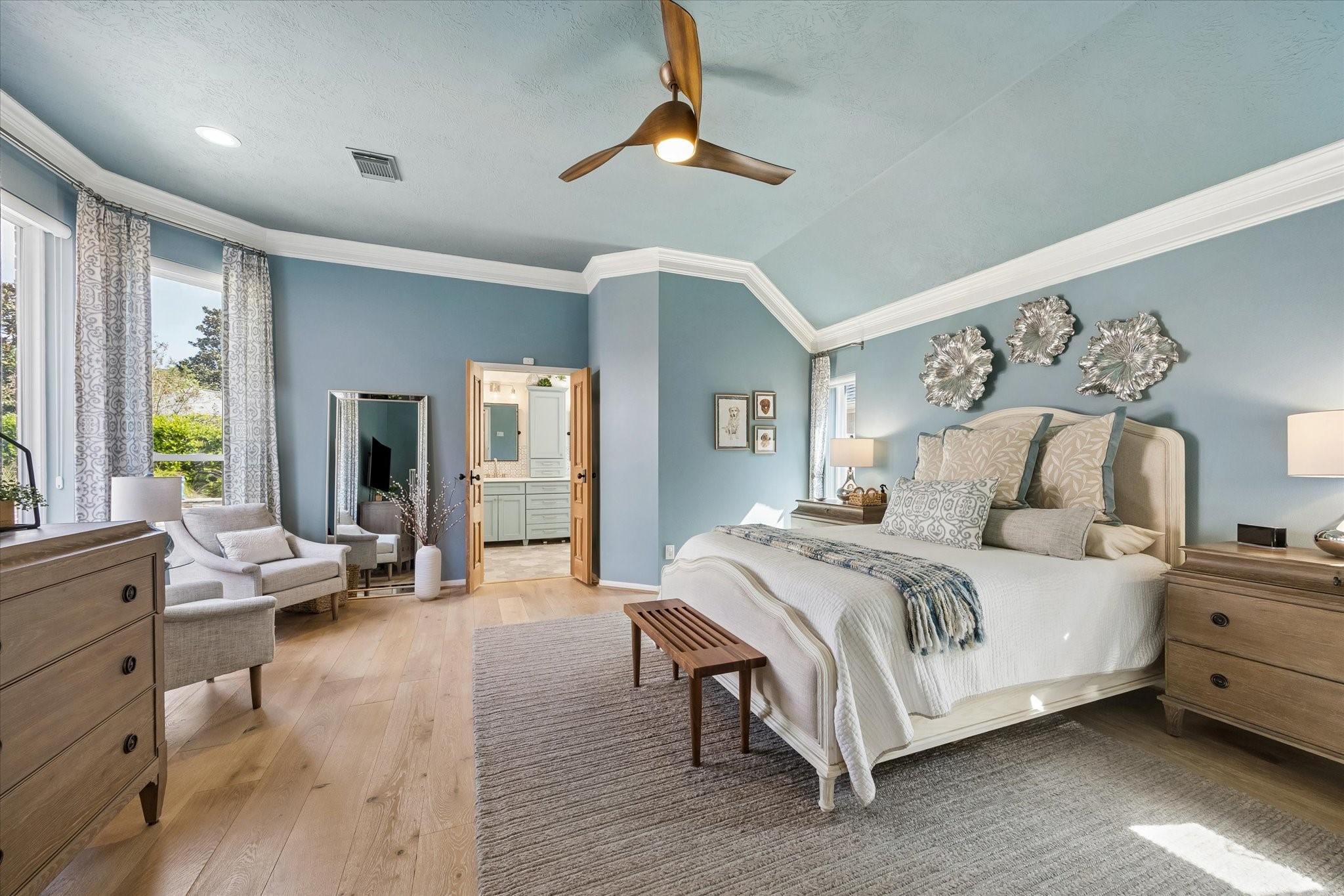 After a busy day, retreat to a spacious primary suite designed for comfort and relaxation. Generous proportions, beautiful flooring, and an inviting atmosphere create a peaceful place to unwind and recharge.