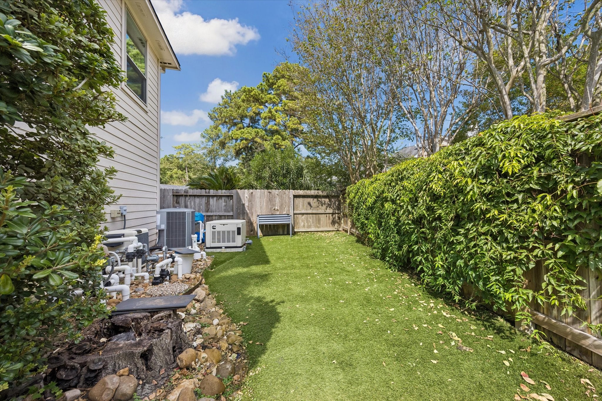 There's more to the backyard than the pool! This additional fenced outdoor space features low-maintenance turf and offers flexibility for pets, planting, play, or simply enjoying a little extra room outdoors.