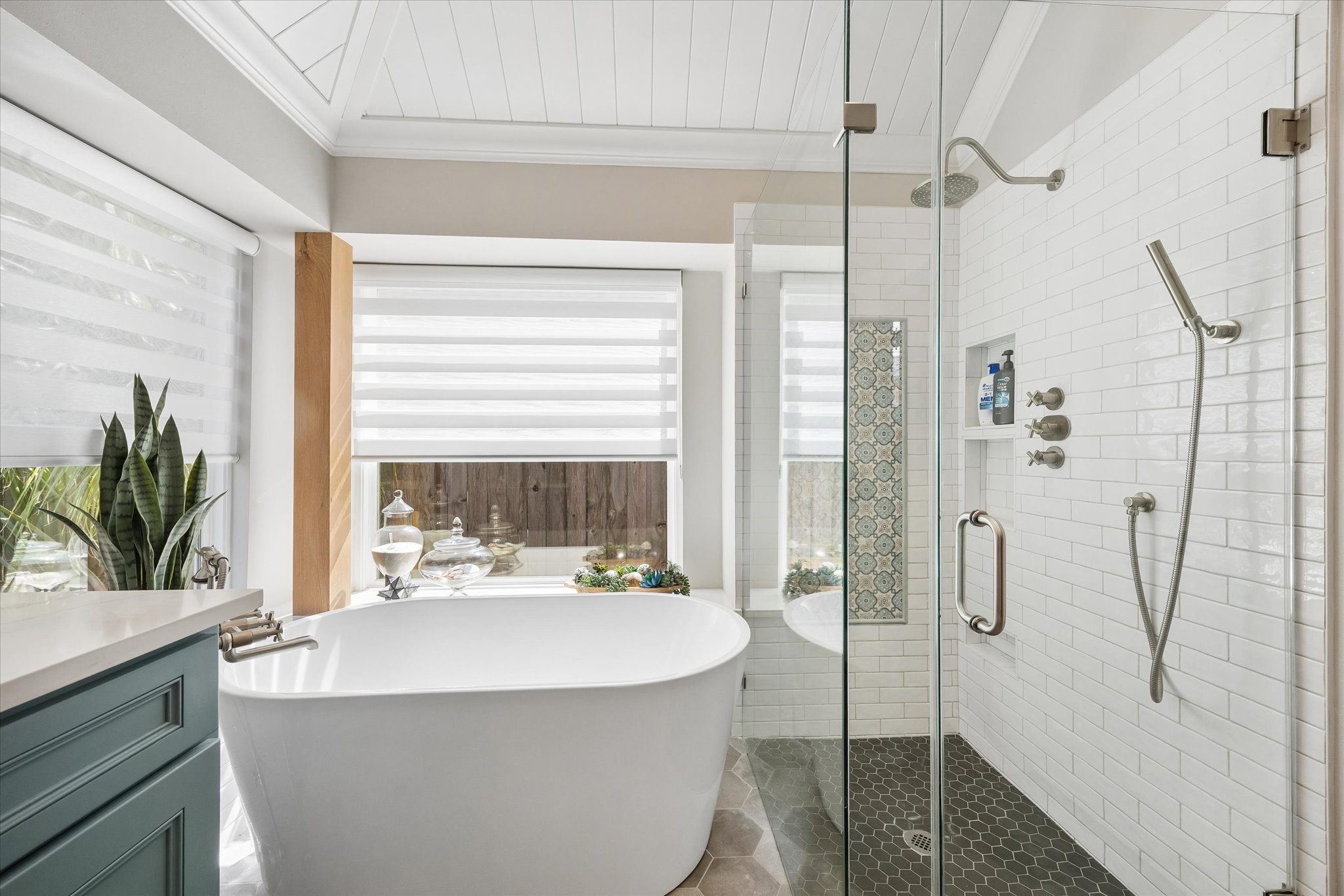 Imagine ending your day with a long soak in the freestanding tub or enjoying the spacious walk-in shower. Custom tilework, elegant fixtures, and a beautifully updated design transform this bathroom into a relaxing retreat just steps from the bedroom.
