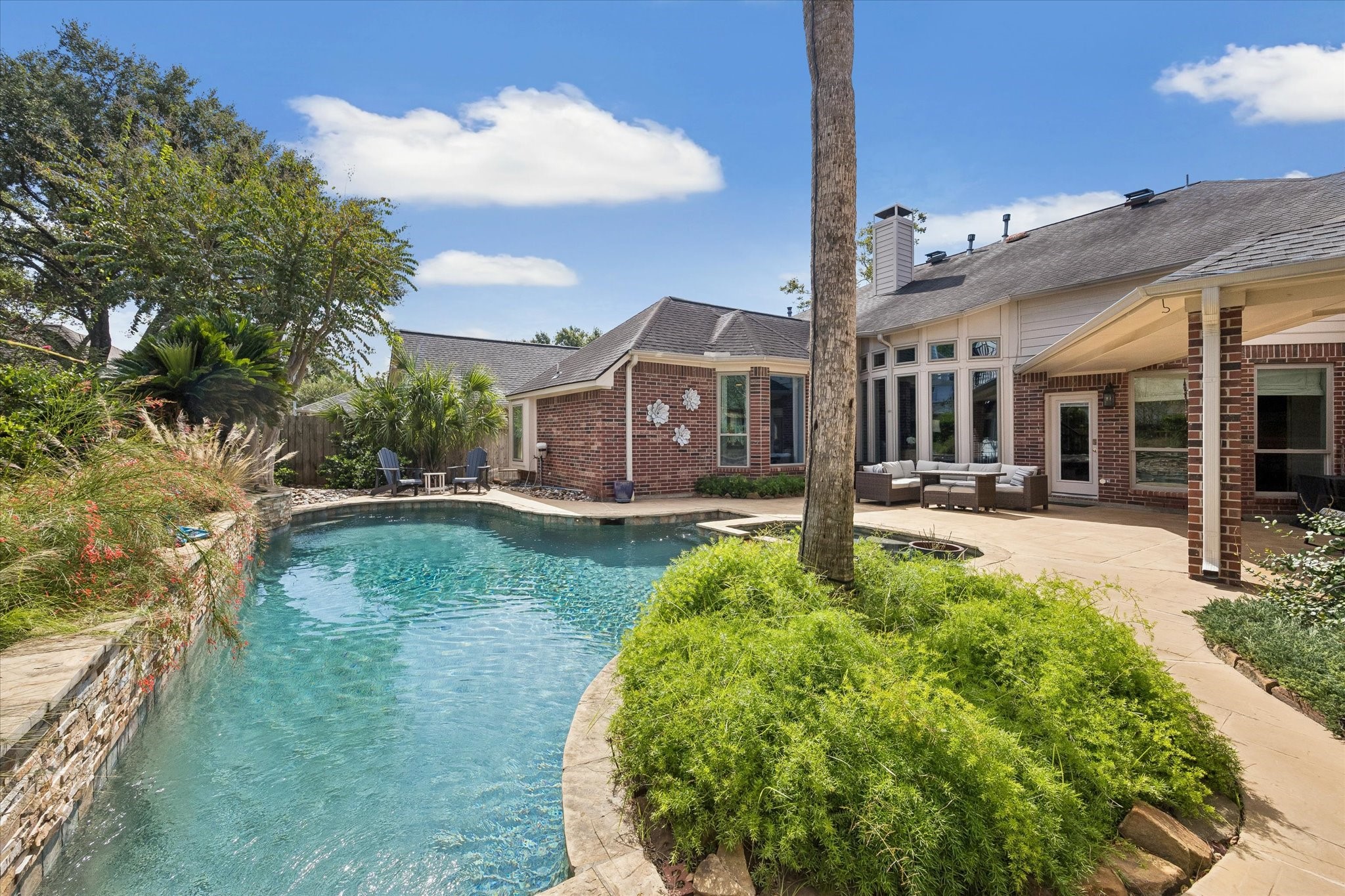 This is where weekends become something special. Whether you're hosting a pool party, enjoying a quiet morning surrounded by lush landscaping, or unwinding in the spa after sunset, this backyard is designed for making memories.