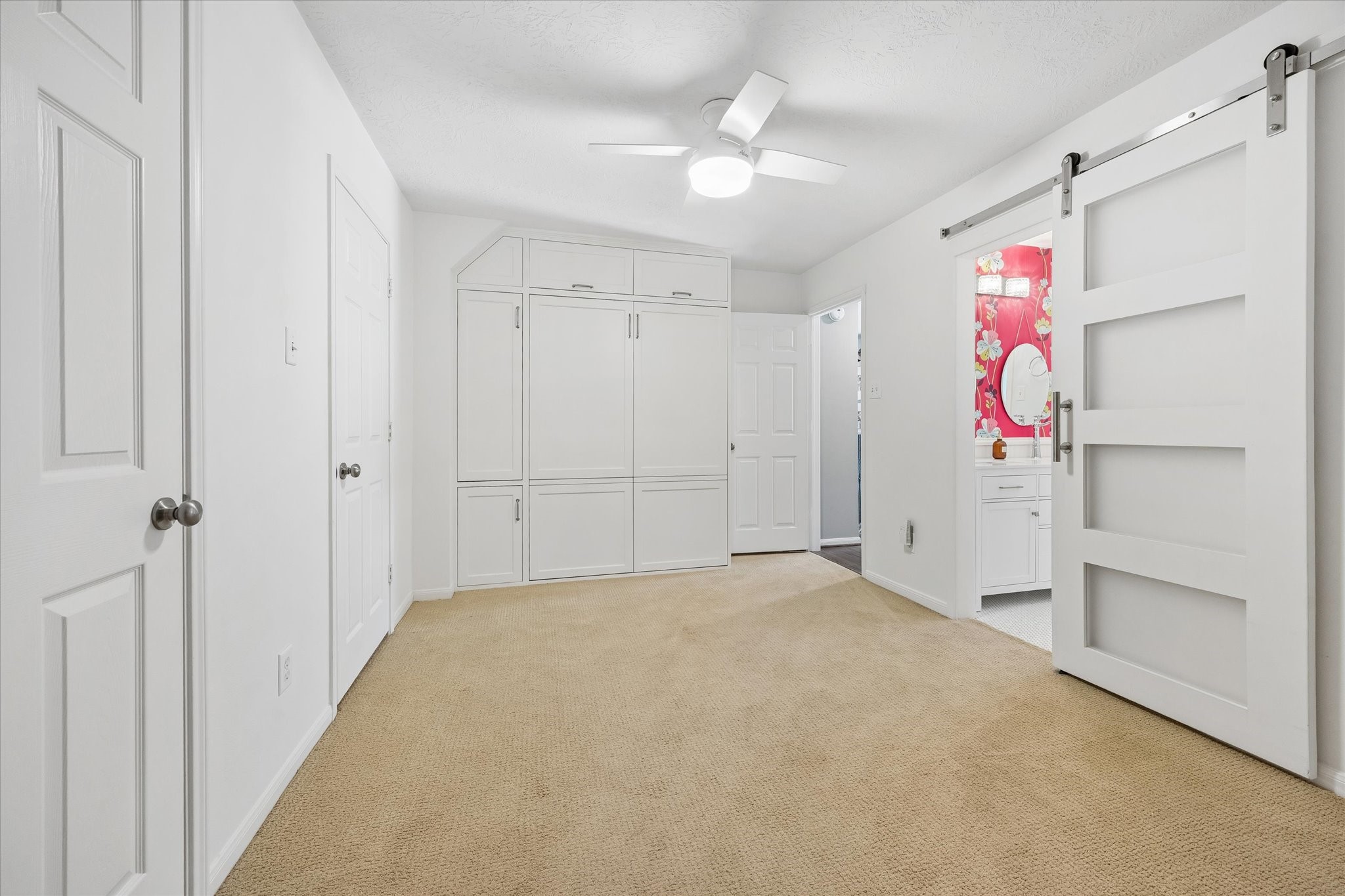 Need a space that can do double duty? This thoughtfully designed room features a built-in Murphy bed and generous cabinetry, giving you the freedom to welcome overnight guests while keeping the room open for everyday activities.