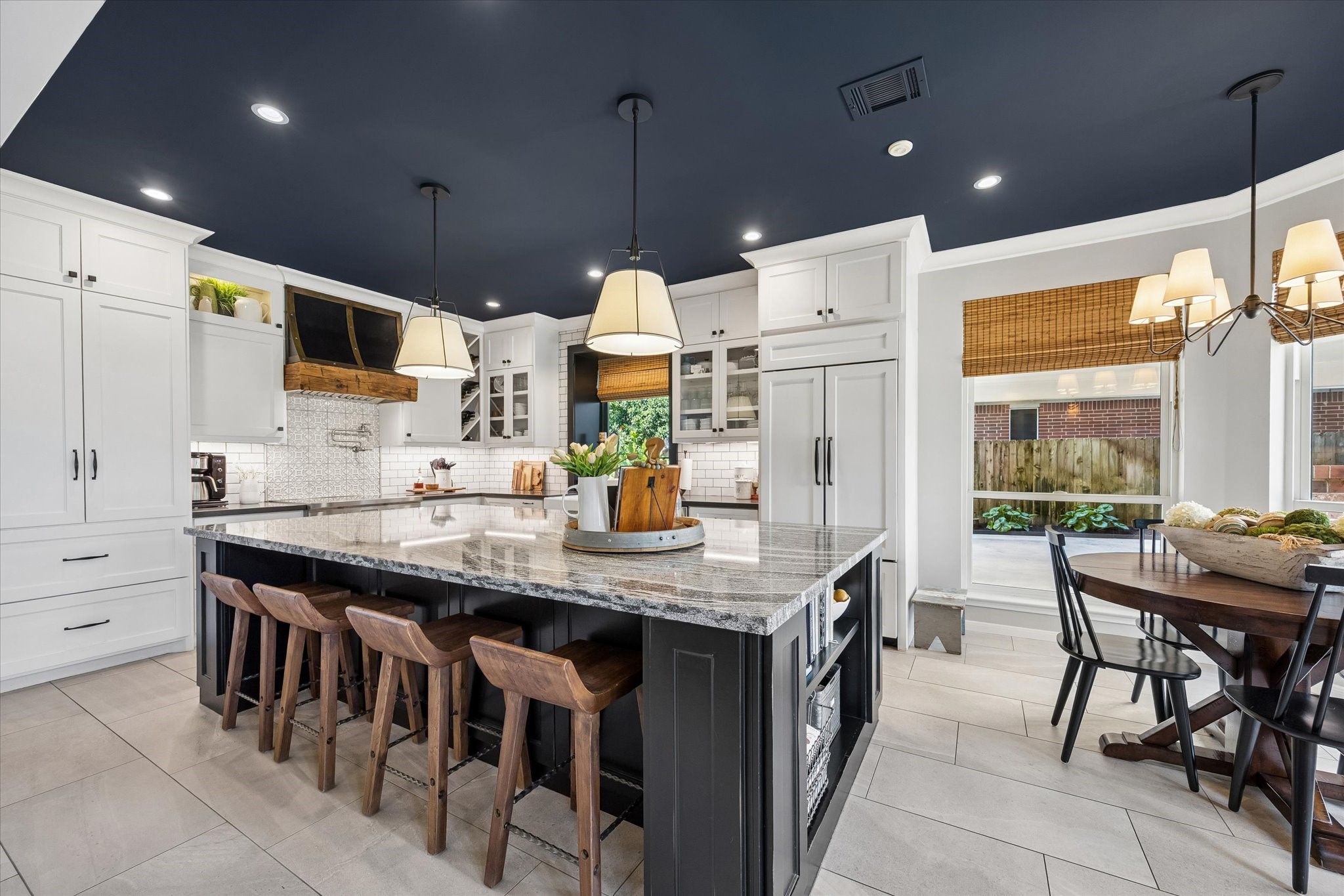 There's always room for one more at the island. Whether it's morning coffee, helping with homework, or gathering with friends while dinner is prepared, this oversized island offers plenty of seating, workspace, and cleverly designed storage.