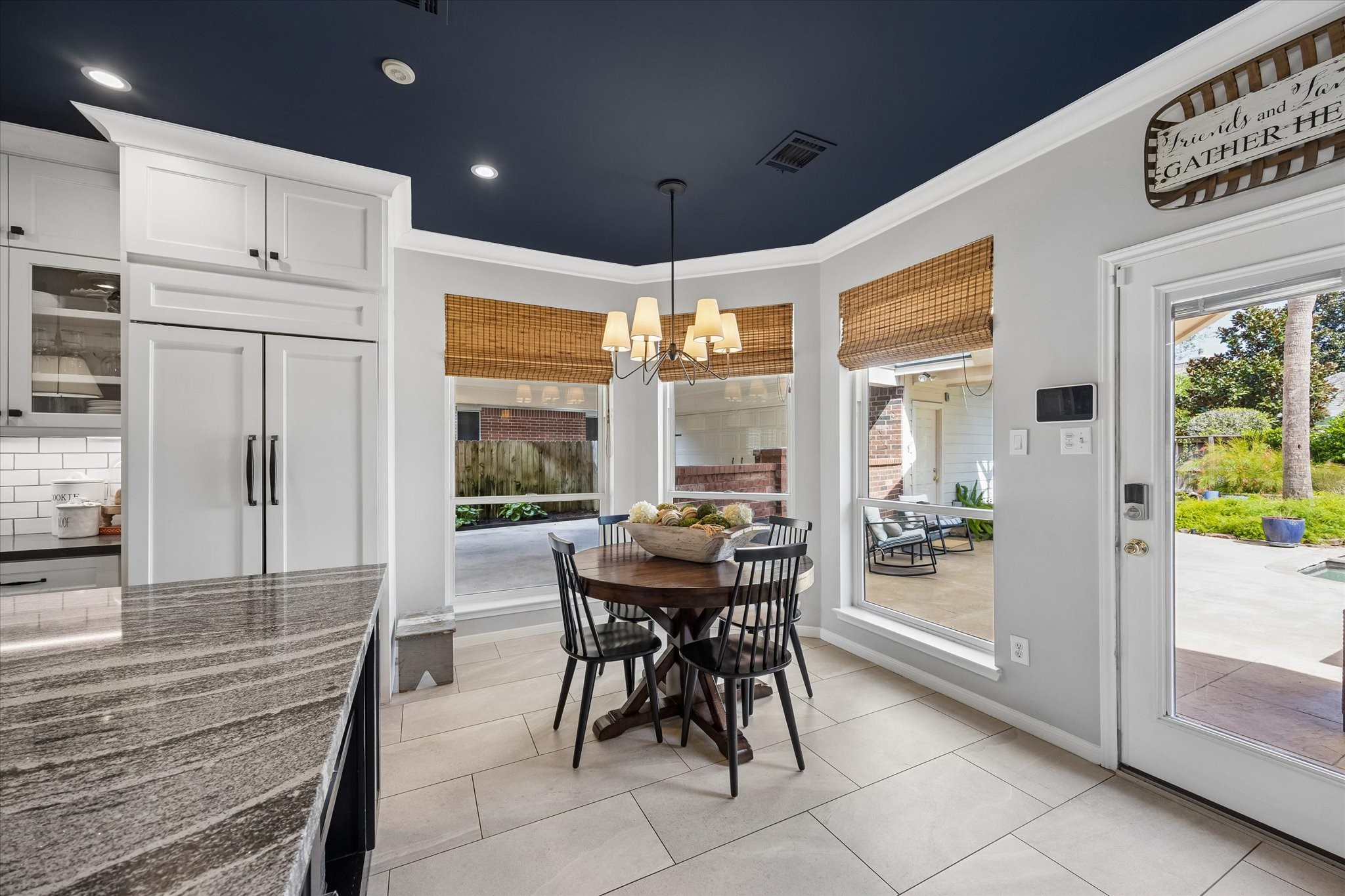 Slow mornings and casual meals feel right at home in this inviting breakfast area. Surrounded by natural light and views of the backyard, it's the perfect place to enjoy your first cup of coffee or gather for dinner after a busy day.