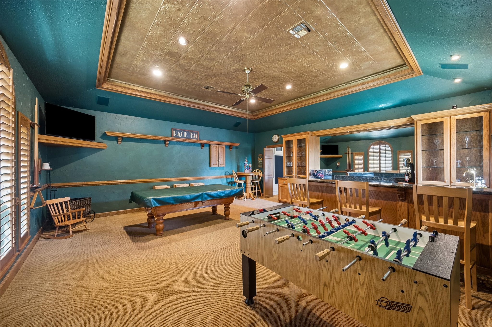 Imagine Friday nights filled with friendly competition, laughter, and a little rivalry over the pool table. With a foosball table, custom wet bar, and plenty of room to gather, this is the kind of space everyone will gravitate toward. Best of all, both game tables stay with the home!