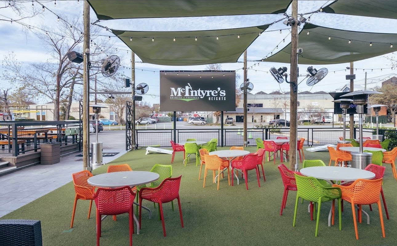 McIntyre's Heights, a popular neighborhood sports bar within walking distance, features spacious outdoor seating, large screens for sporting events, and a lively social atmosphere.