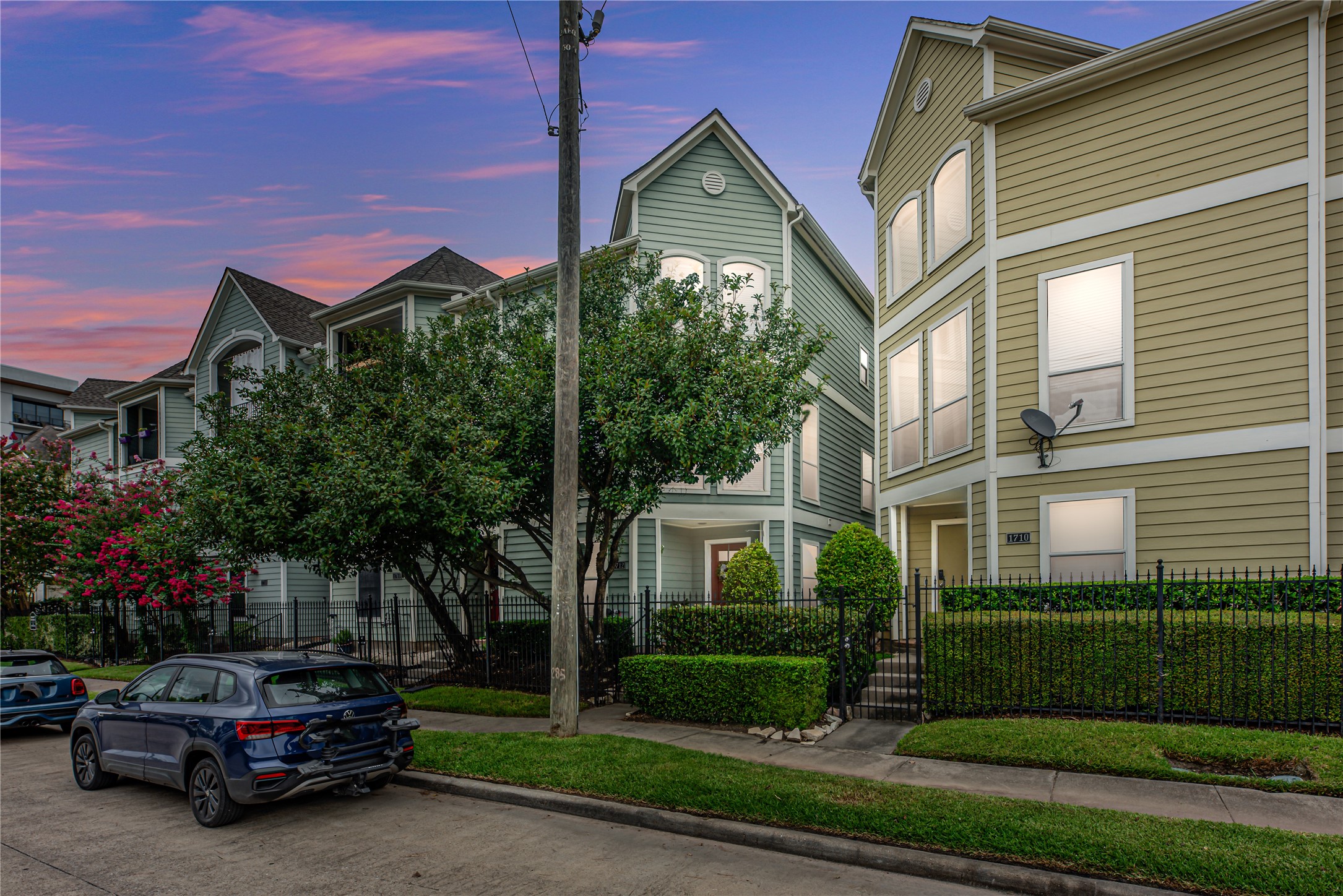Located in the desirable Greater Heights area, this three-story townhome features a light exterior, a 2-car garage, and convenient street-front parking. A pedestrian-gated entrance leads to the front yard, offering added privacy and a welcoming entry to the home.