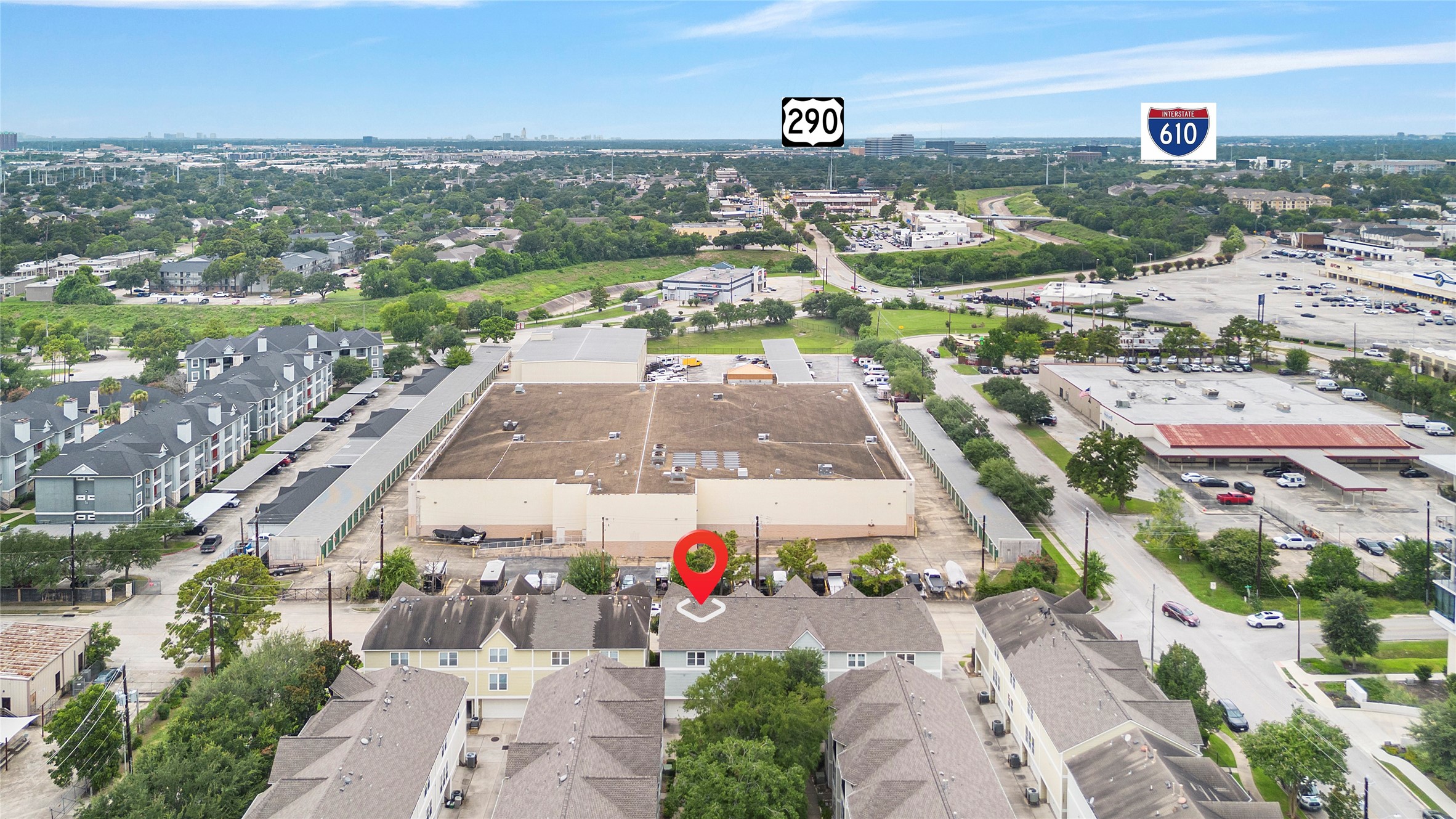 Aerial view showcasing the surrounding Houston skyline and convenient location near major roadways, making it easy to access Downtown and other popular areas of the city.