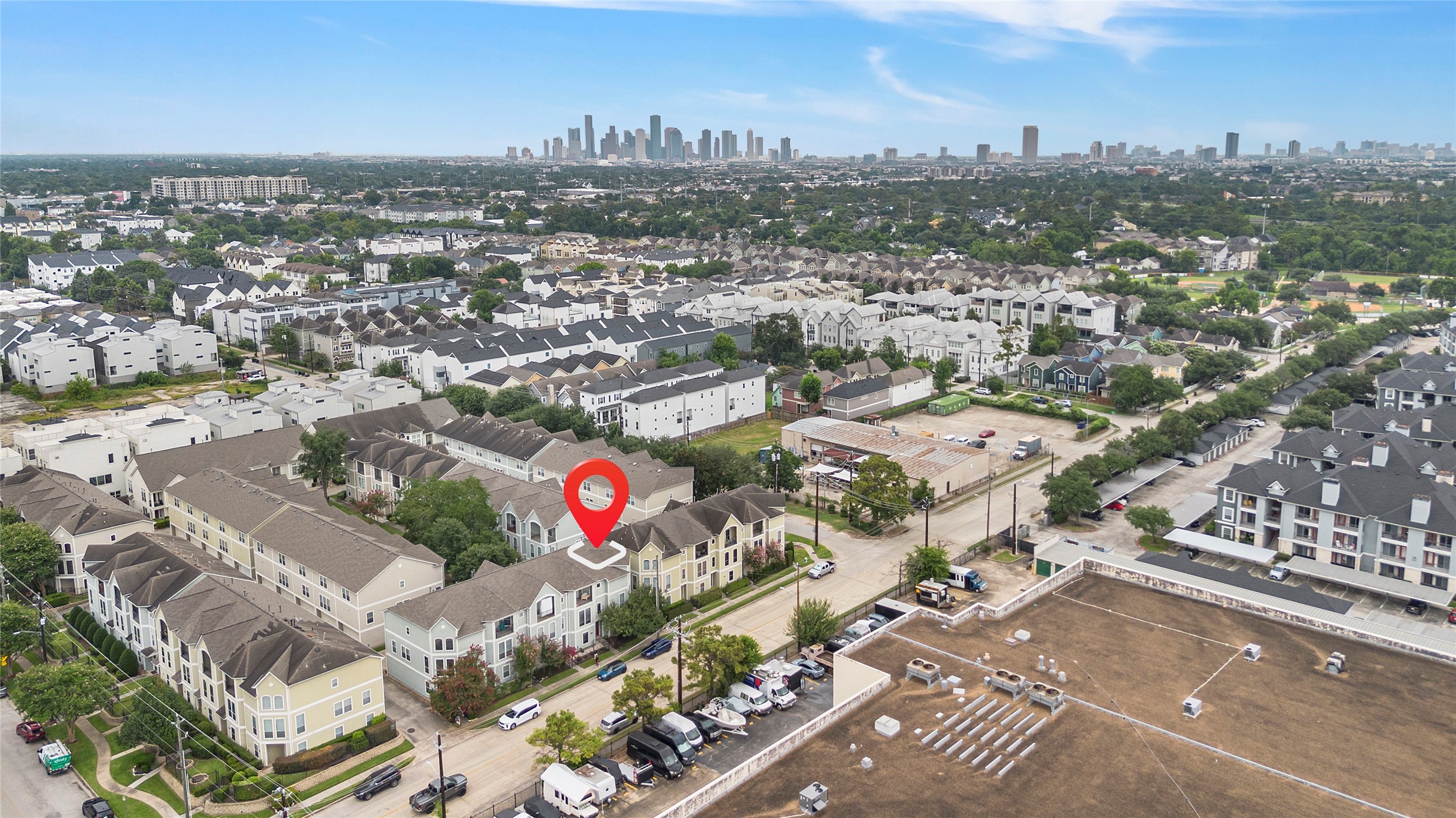 Location, location, location! This aerial view showcases the homes prime Greater Heights location, with Downtown Houston visible in the distance and convenient access to major roadways, parks, dining, shopping, and nearby city amenities.