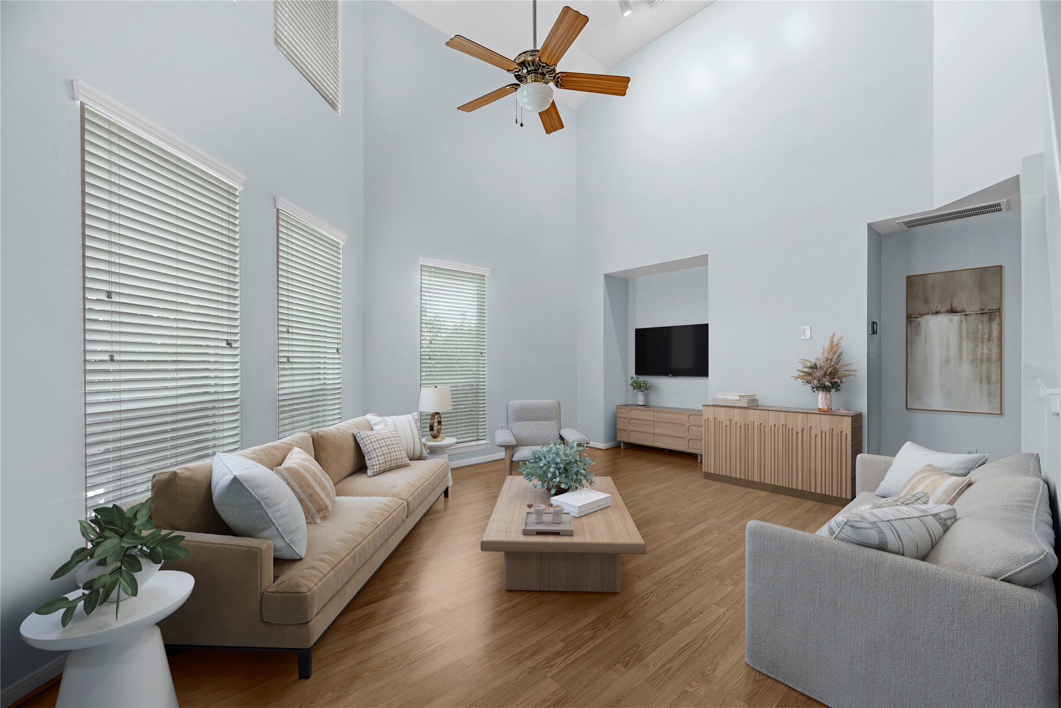 Welcome to 1712 Bevis! This virtually staged living area showcases the bright and spacious layout, featuring high ceilings, large windows with plantation shutters, a ceiling fan, and updated flooring. The open-concept design flows seamlessly into the dining area and kitchen, with an open staircase leading to the upper level. Welcome to 1712 Bevis! This virtually staged living area showcases the bright and spacious layout, featuring high ceilings, large windows with plantation shutters, a ceiling fan, and updated flooring. The open-concept design flows seamlessly into the dining area and kitchen, with an open staircase leading to the upper level.