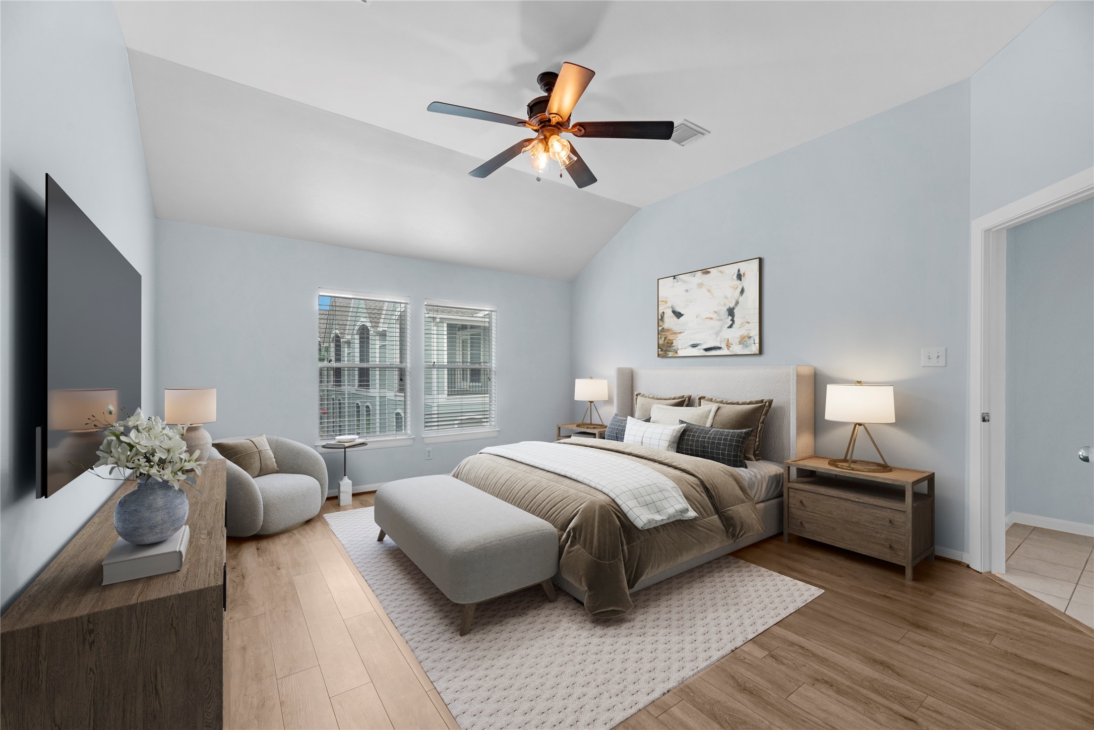 Located on the third floor, this spacious bedroom features high ceilings, two windows that bring in plenty of natural light, and an oversized walk-in closet with generous storage space. The upper-level location provides added privacy and a comfortable retreat within the home. (virtually staged)