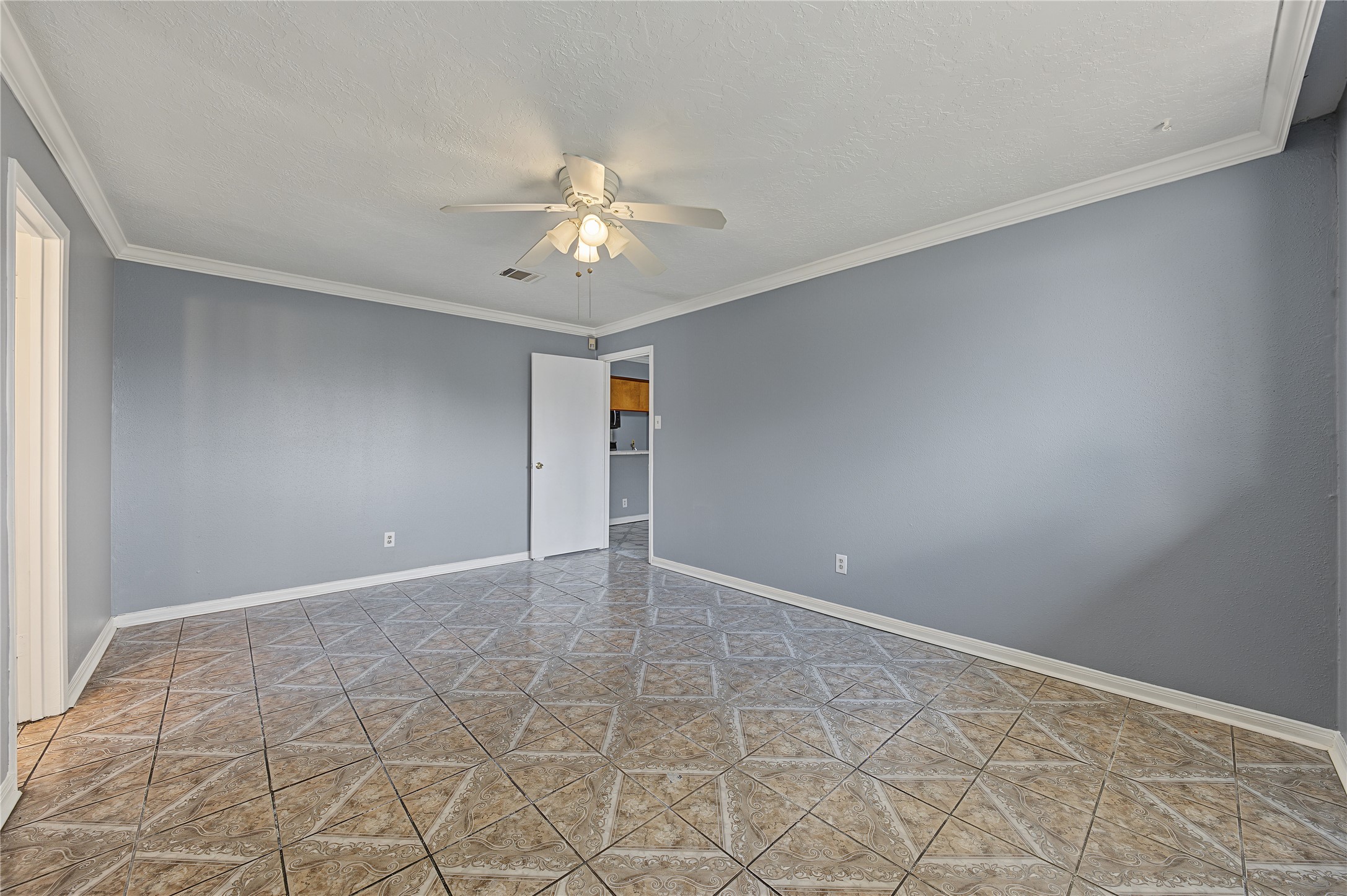 Spacious primary bedroom offering a neutral canvas ready for your personal touch.
