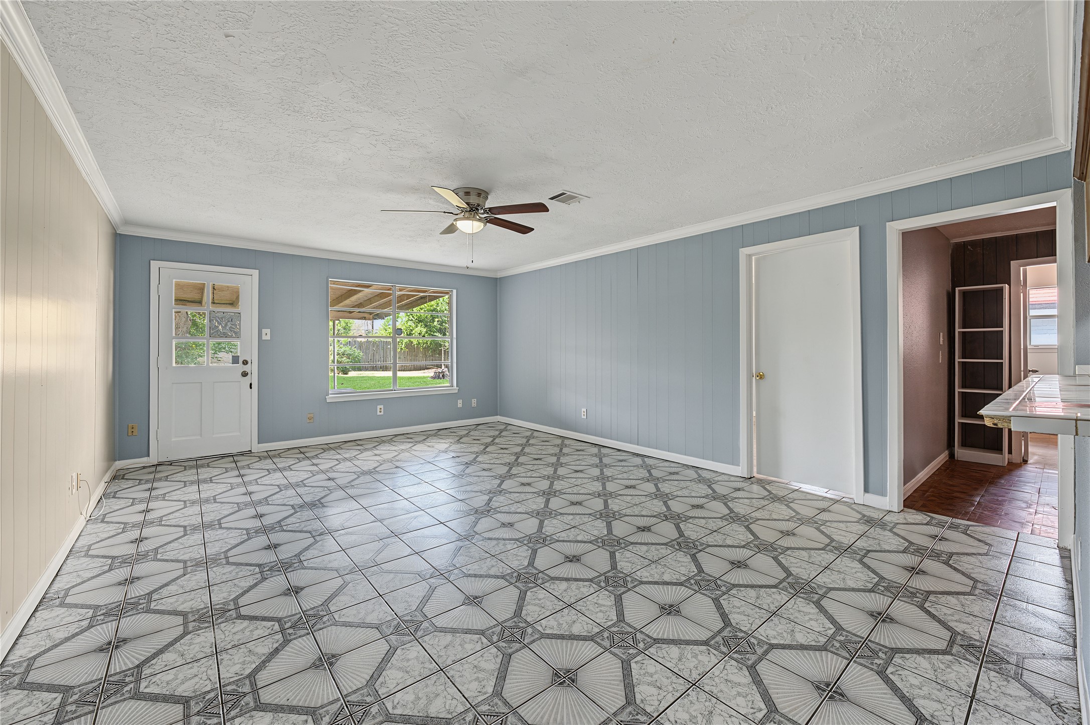 Open living room showcasing freshly painted walls and great natural light.