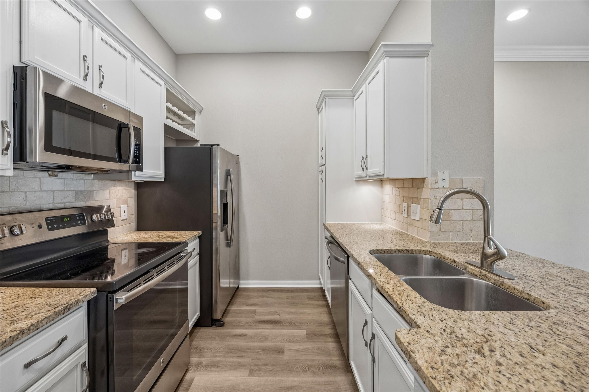Stainless steel appliances with granite counter tops.