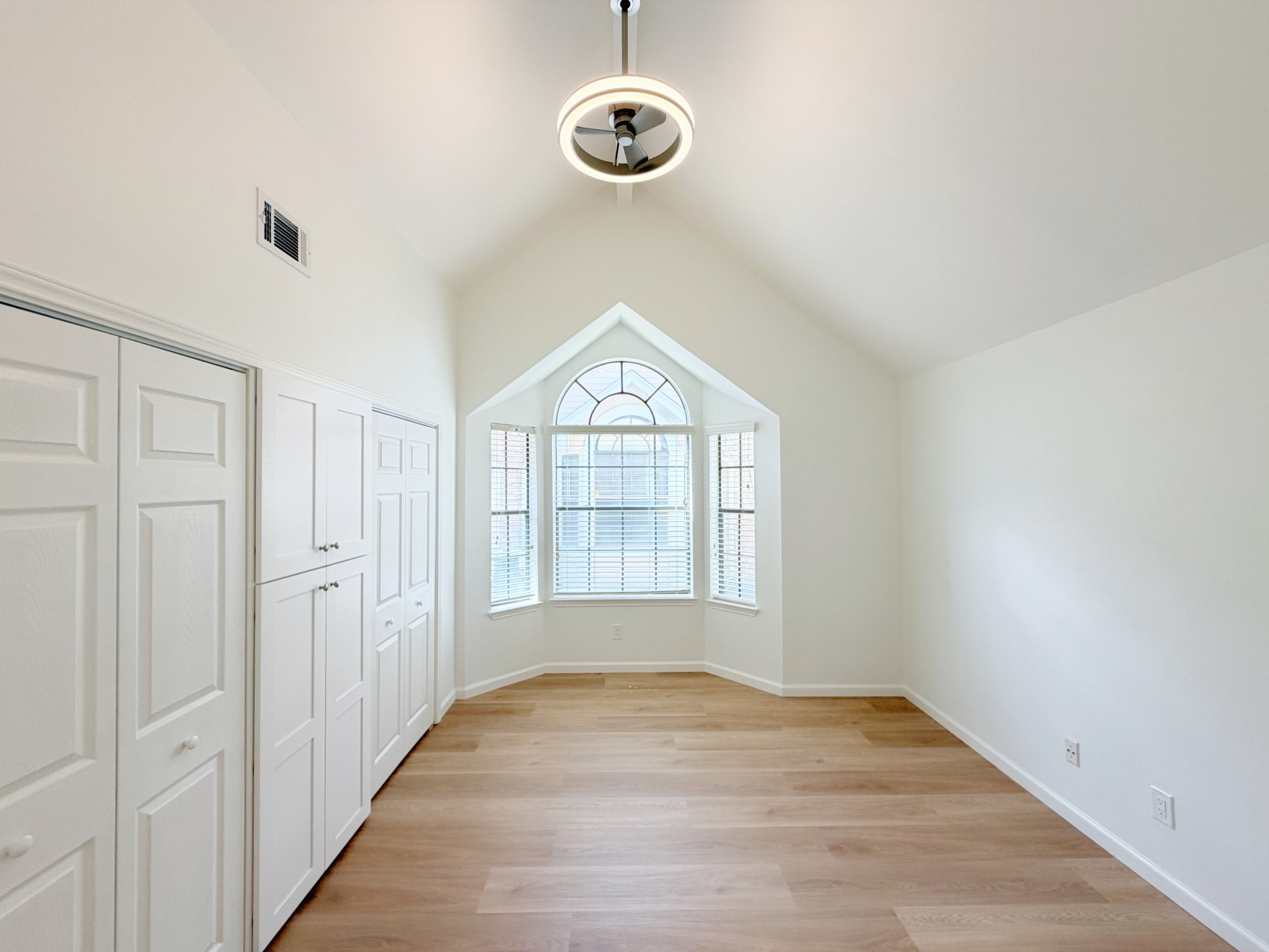 Bedroom with soaring ceilings