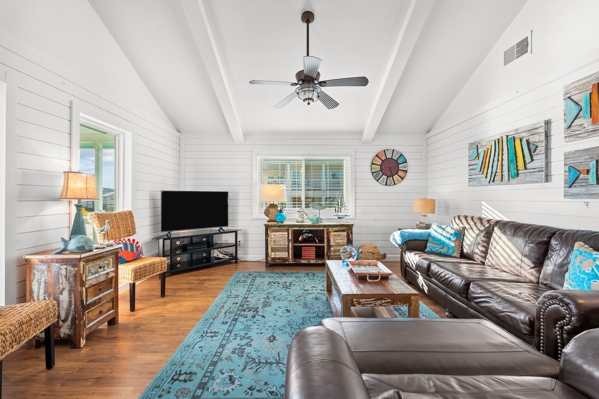 This inviting living room creates a warm and stylish atmosphere perfect for relaxation or entertaining.