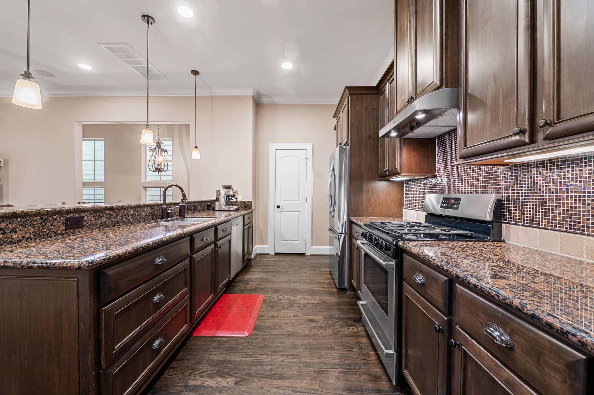 The galley style kitchen is set up in a "chef's triangle" manner and has tons of counter top space.