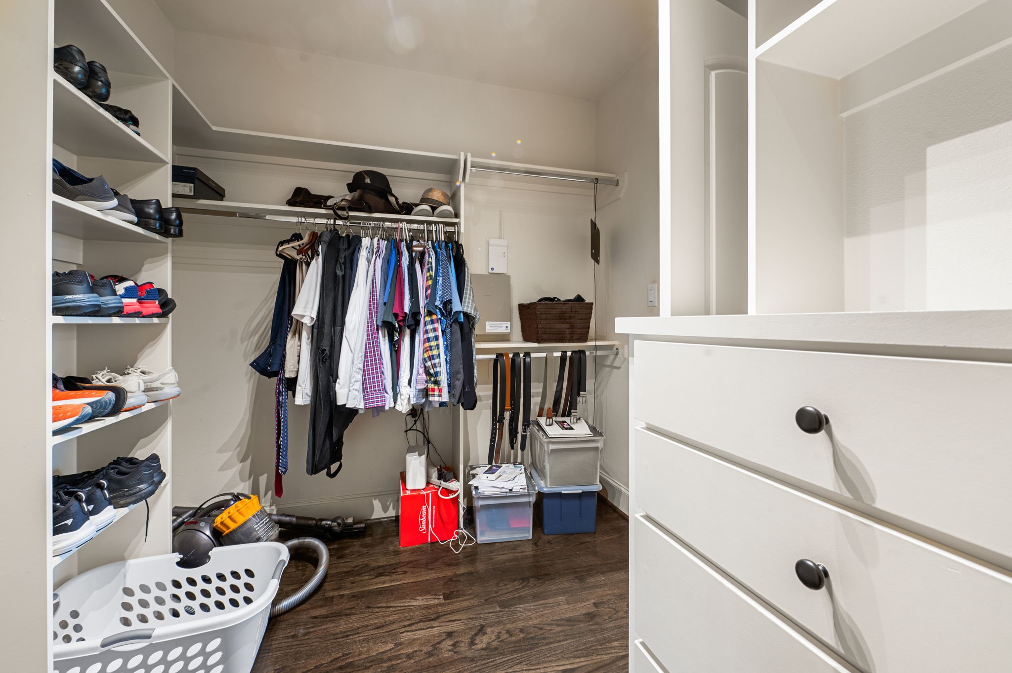 Another view of the Primary closet (More wood floors!)