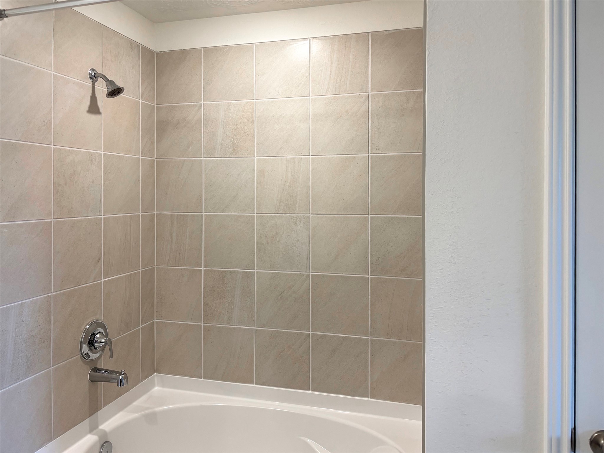 A large soaking garden tub makes the primary bath a well deserved getaway.