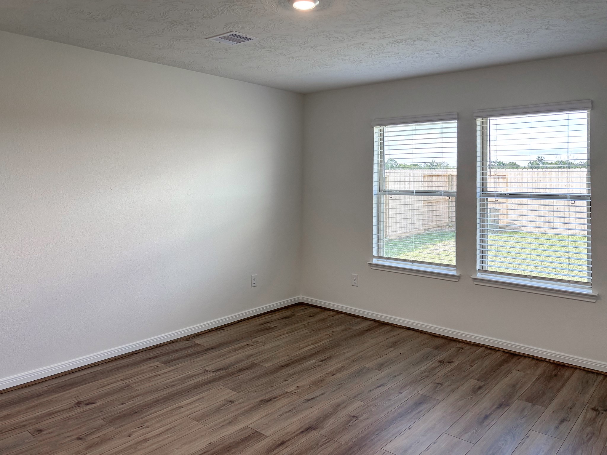 The large primary bedroom will easily accommodate a king size bed and additional furniture.