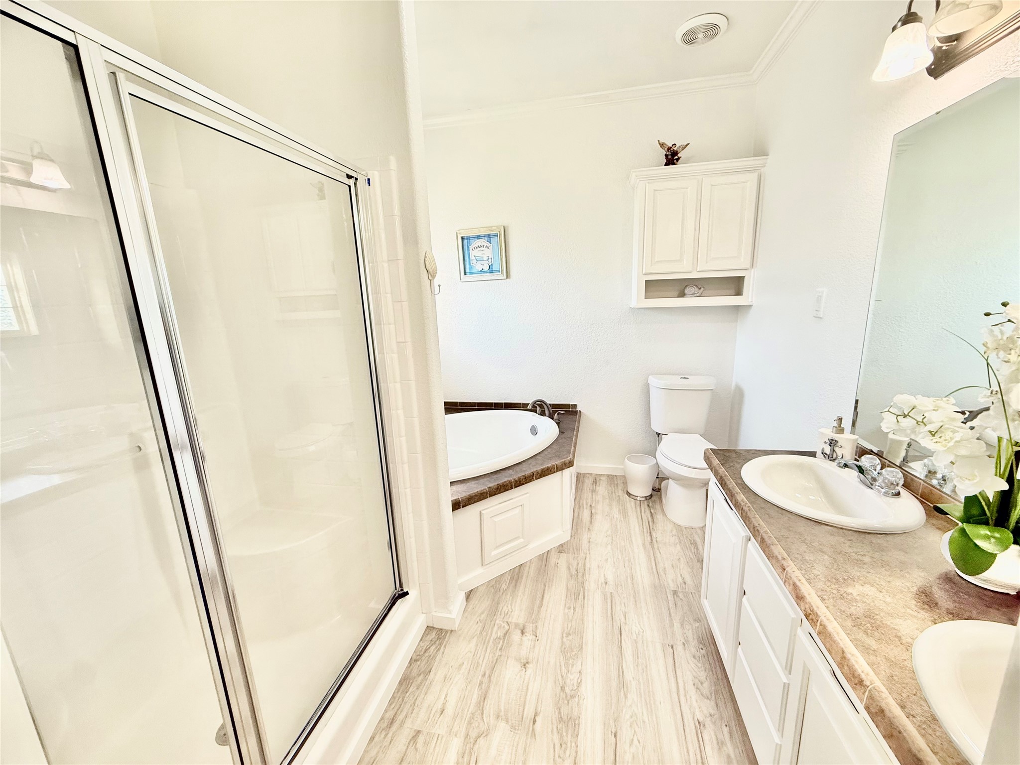 Primary restroom with separate tub and shower.