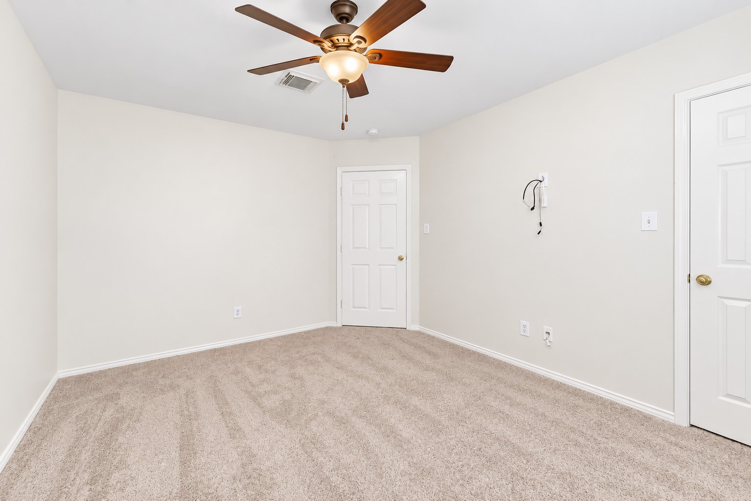2nd bedroom with a large walk in closet.