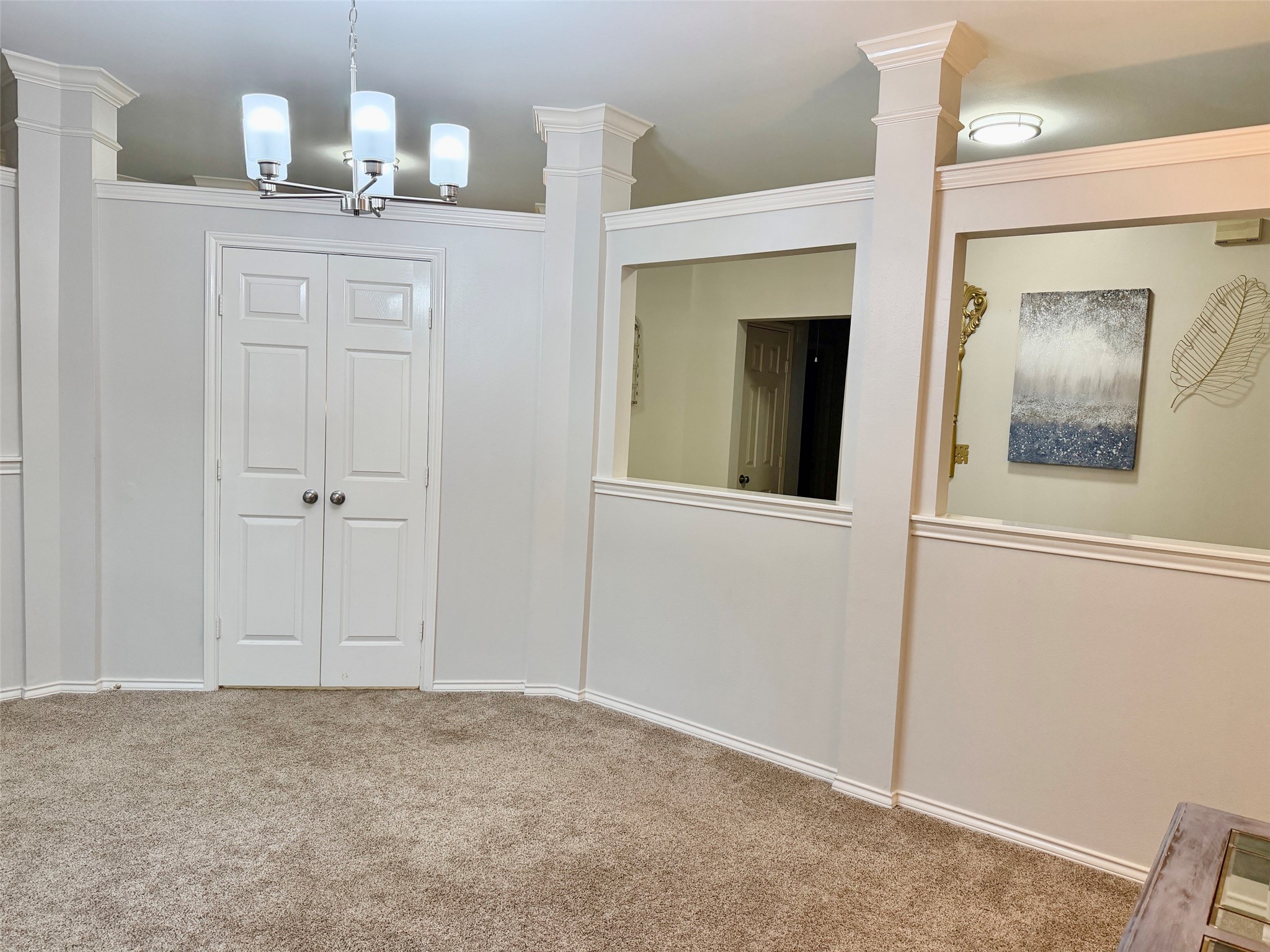 The formal dining room is right in the front.  Double doors for privacy. New light fixture and all new hardware on the doors.