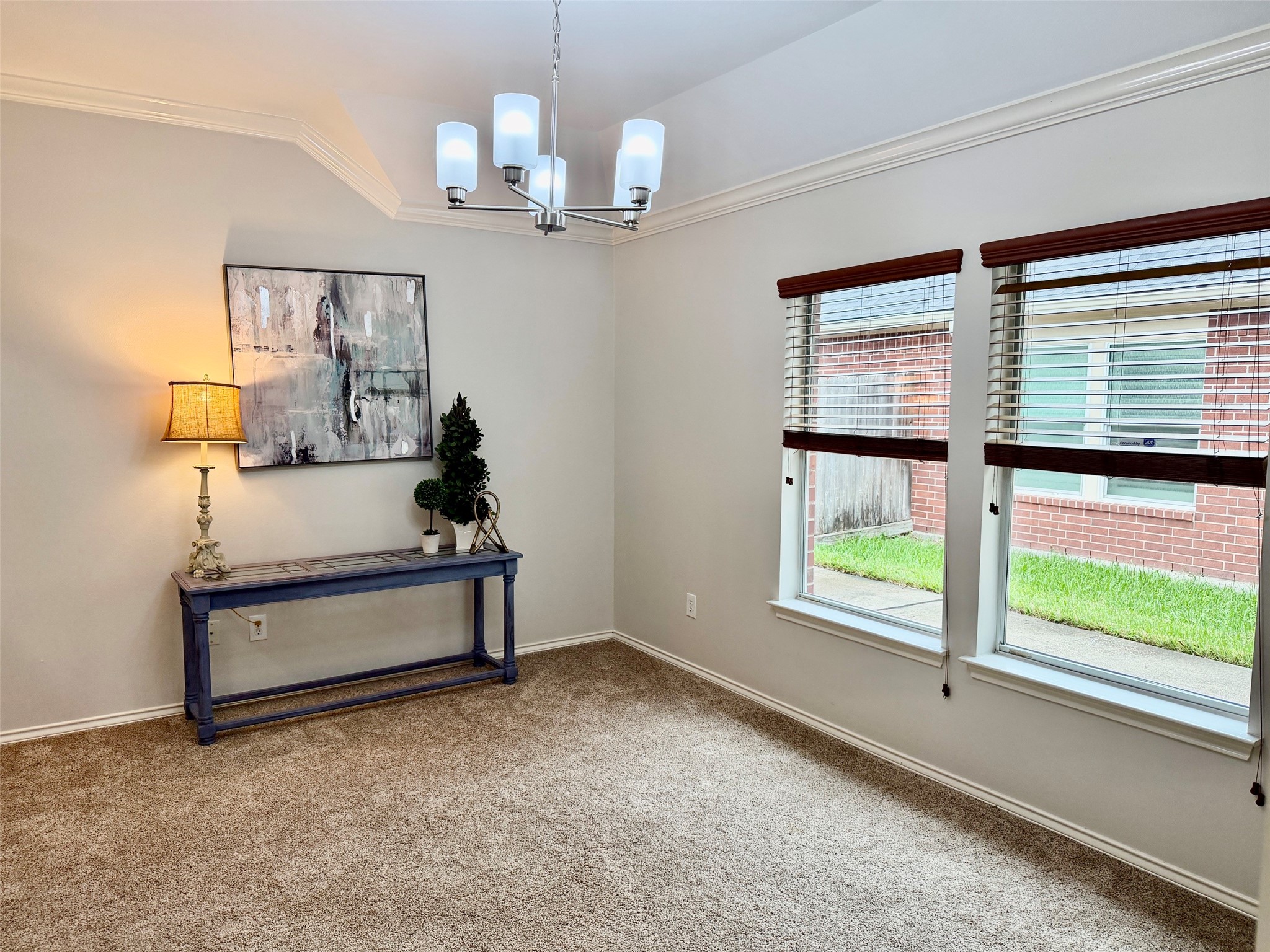 View of the formal dining room.  Plenty of light and a comfortable room that would hold a large table.