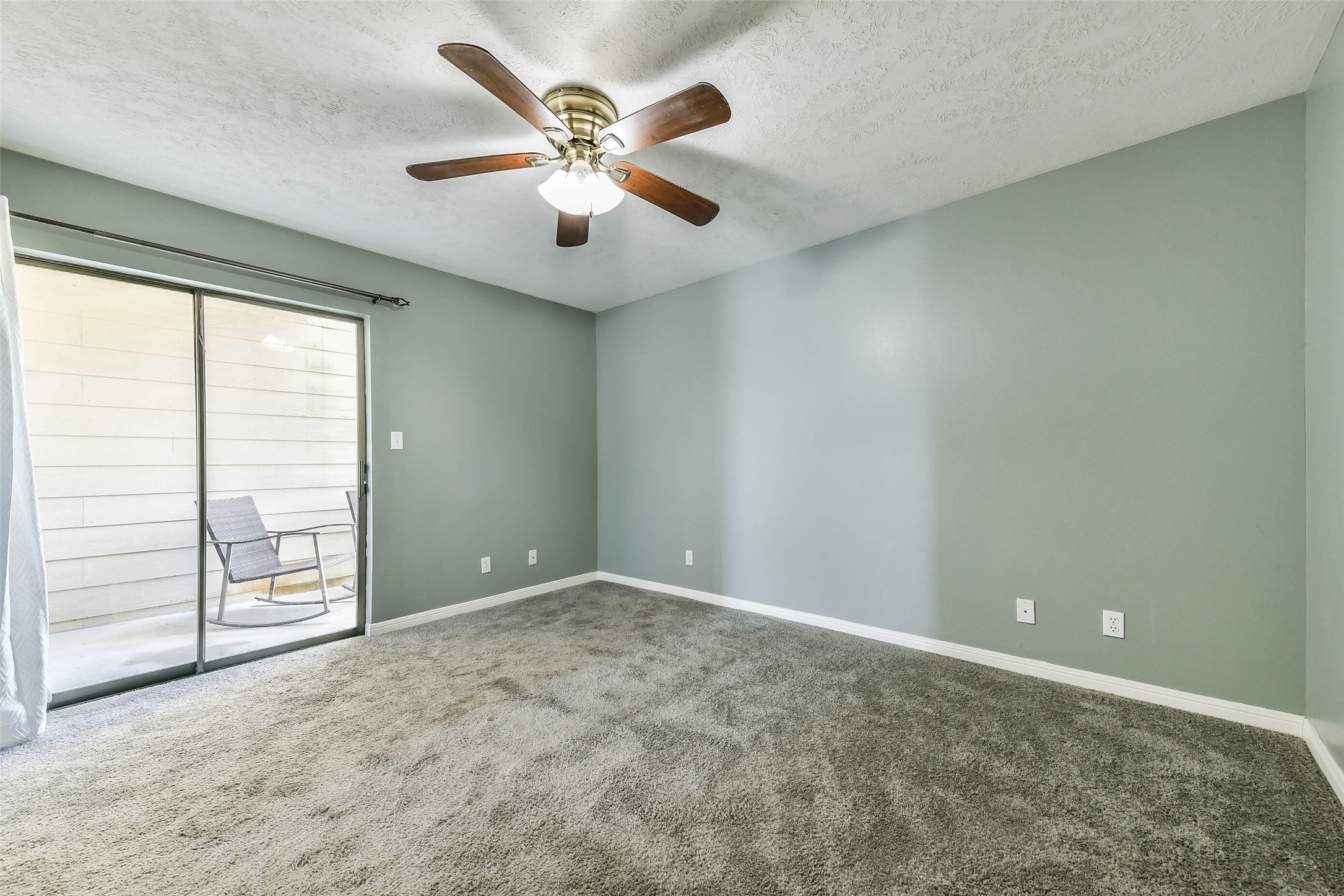 Primary Bedroom with attached balcony