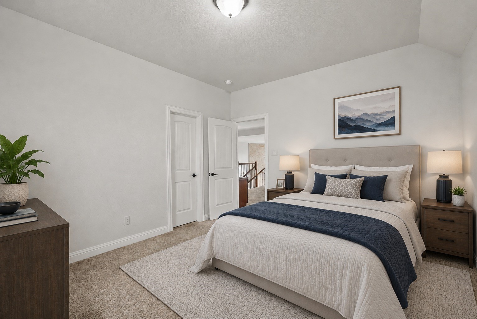 Virtually Stagged - Comfortable secondary bedroom includes access to the Jack-and-Jill style bath and easy access to the upstairs living space, a private, versatile spot for family or guests!