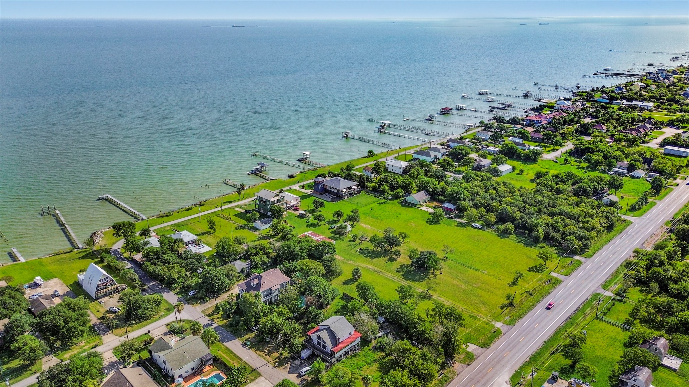 Coastal living at its finest with stunning waterfront views, lush greenery, and charming homes, all just steps from the shoreline, restaurants and local shops.