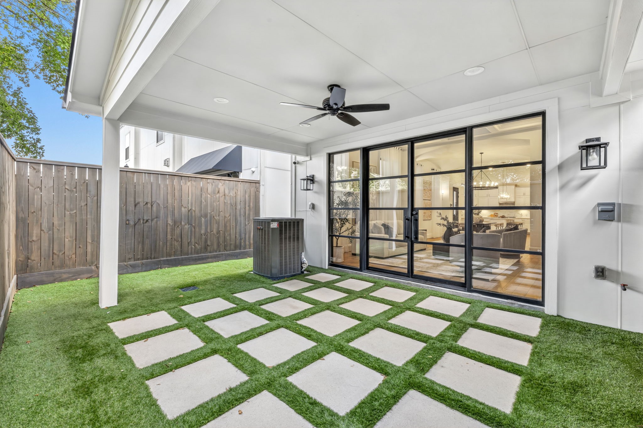 Broad covered patio extends your living area outdoors for shaded dining and relaxation