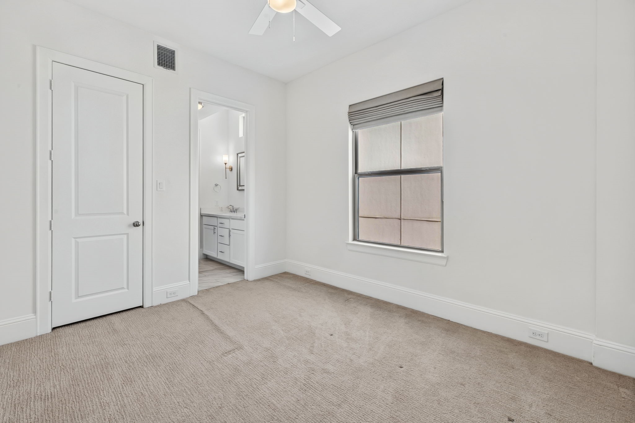Secondary bedrooms share a full bath with double vanity.