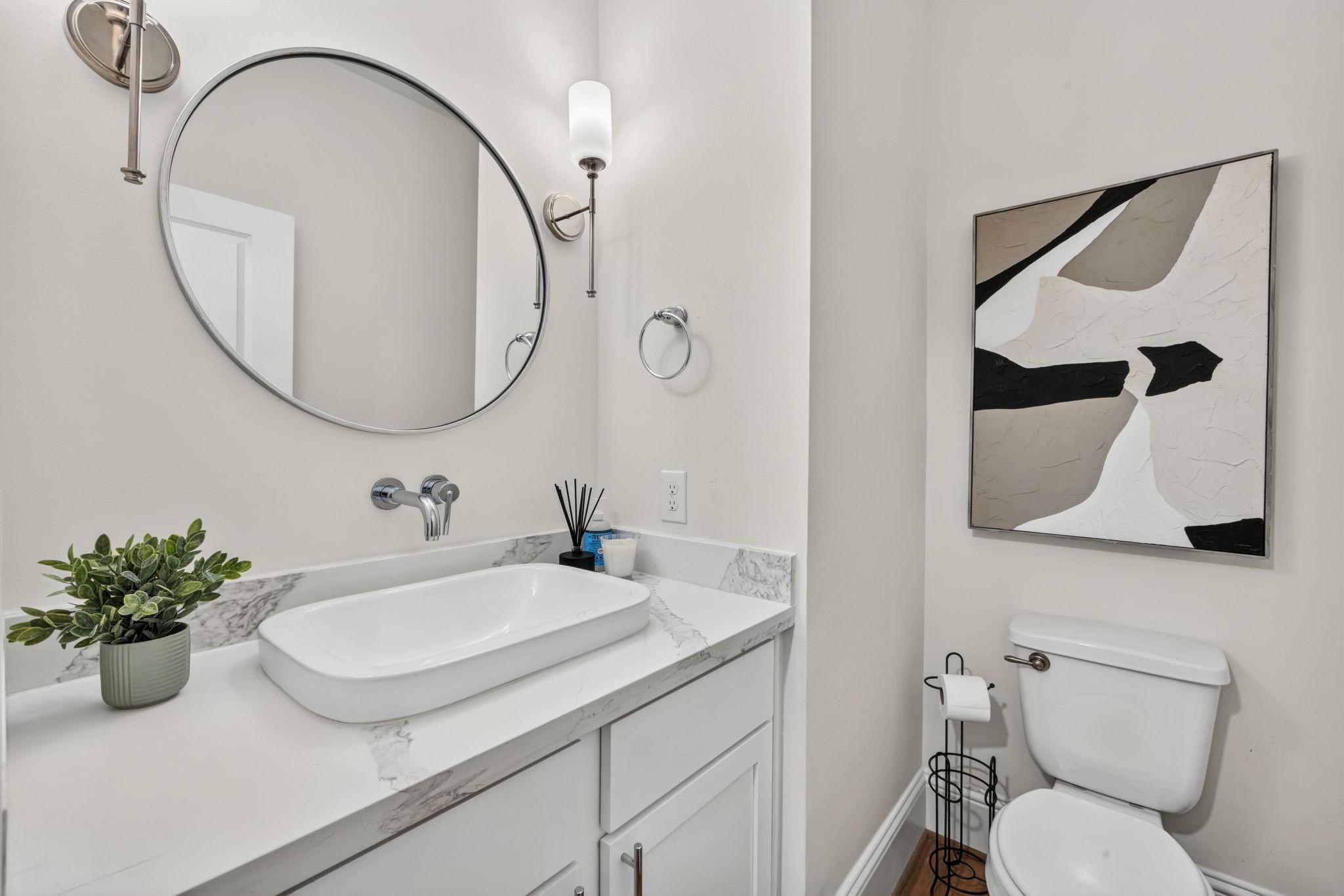 Easily accessible first-floor powder room ideal for guests Easily accessible first-floor powder room ideal for guests