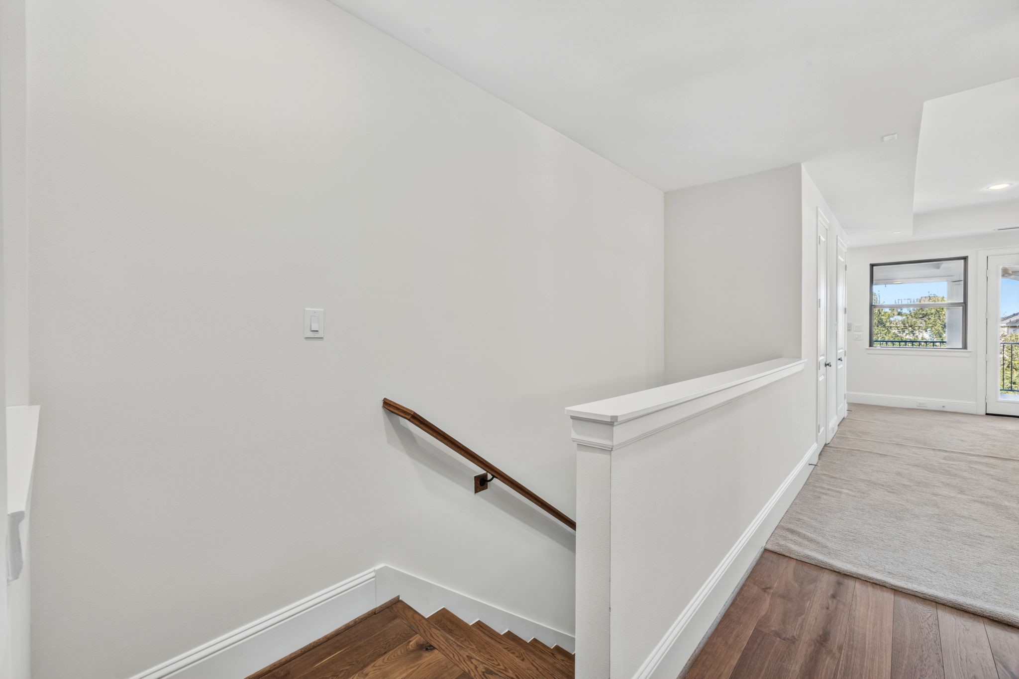 Perched on the top level, this spectacular third-floor game room flows seamlessly out to an expansive terrace