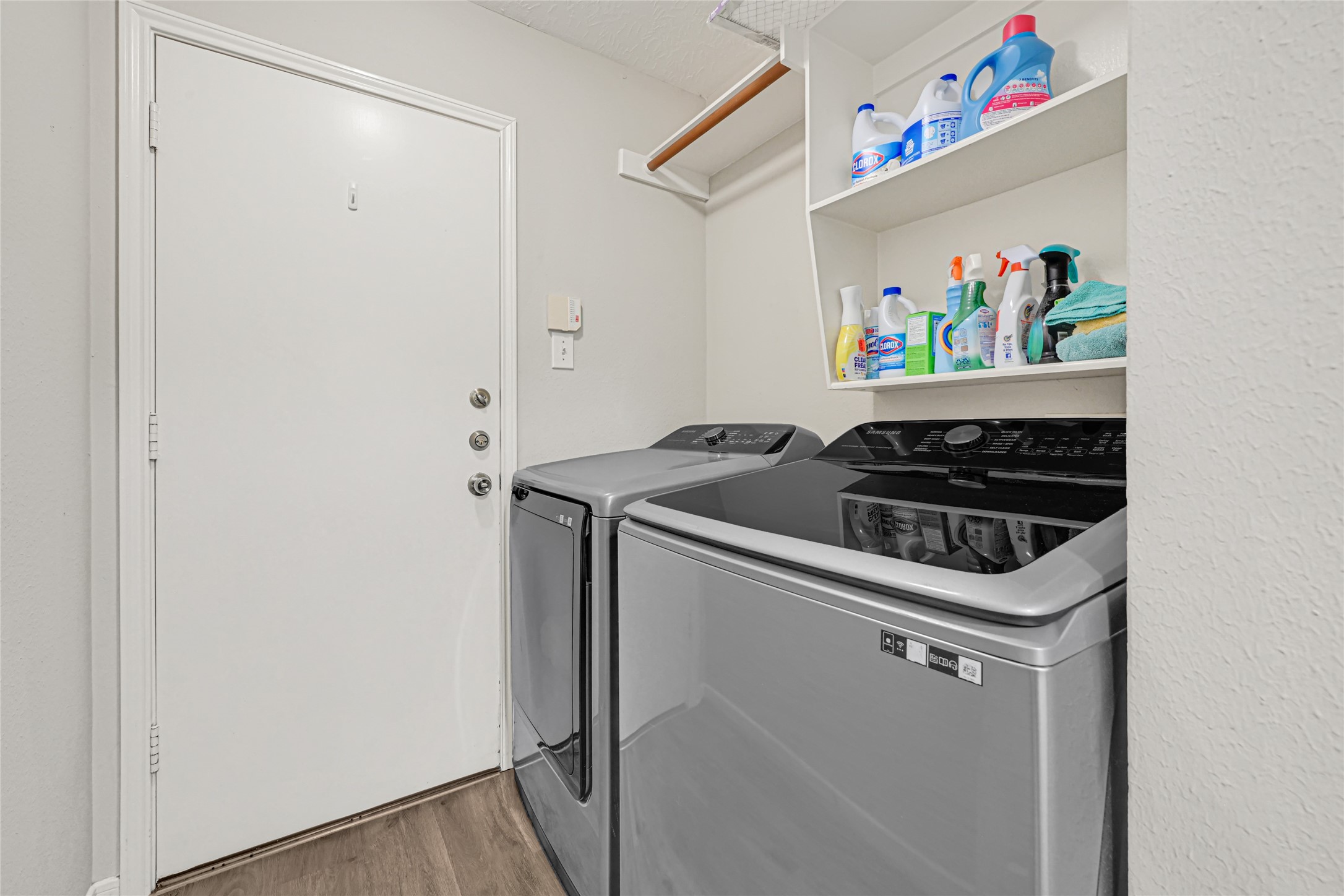 indoor laundry room leads to the garage. Garage has epoxy flooring for a finished/elevated look
