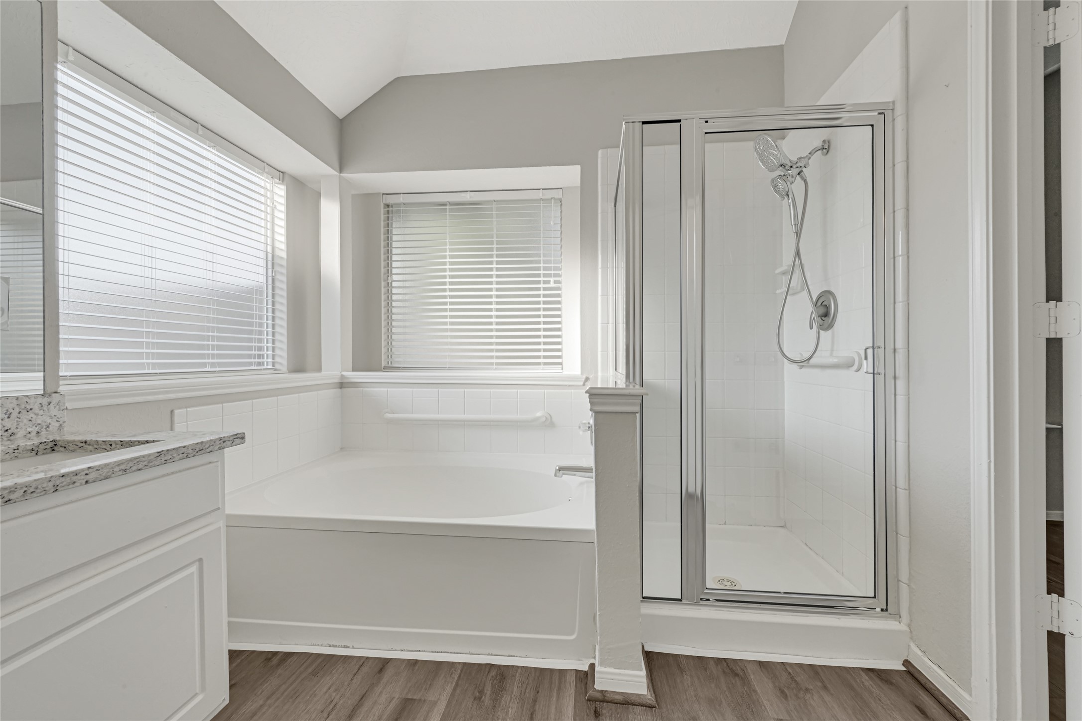 primary bath has a garden tub for long hot baths and a separate shower