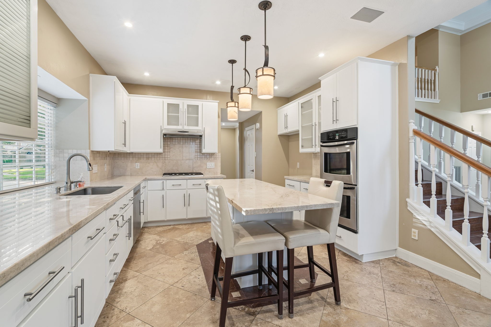 Open concept space leading into kitchen nook and living room.