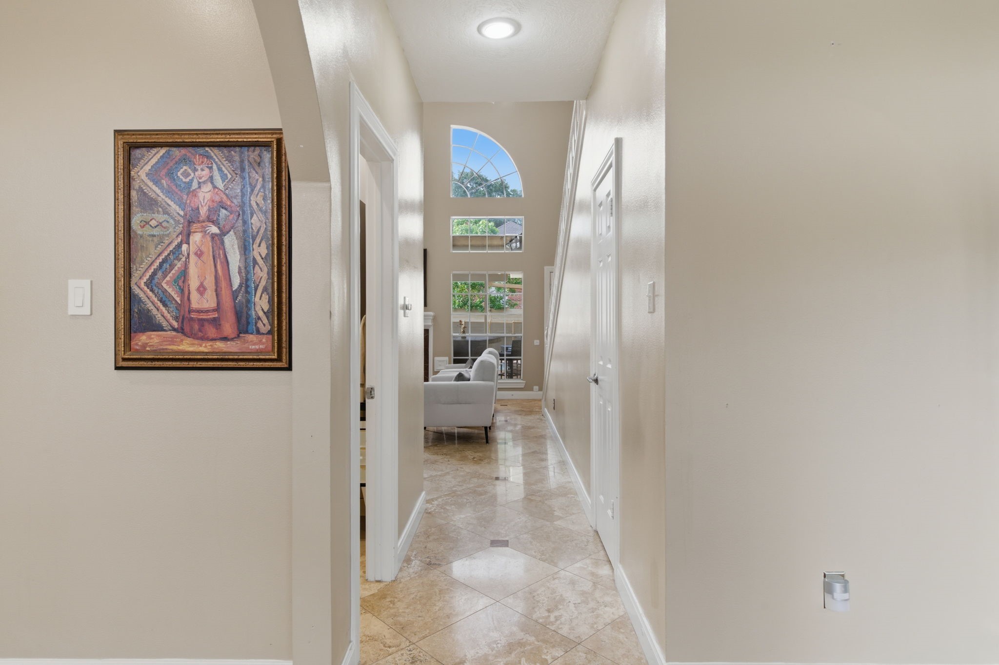 Stunning natural light leading from the entrance of the home into the spacious living room