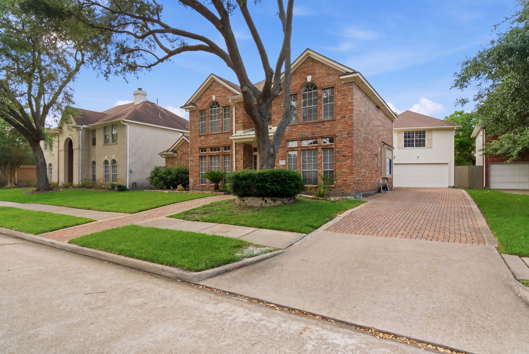 Owners extended driveway to create more space for added cars- perfect for hosting